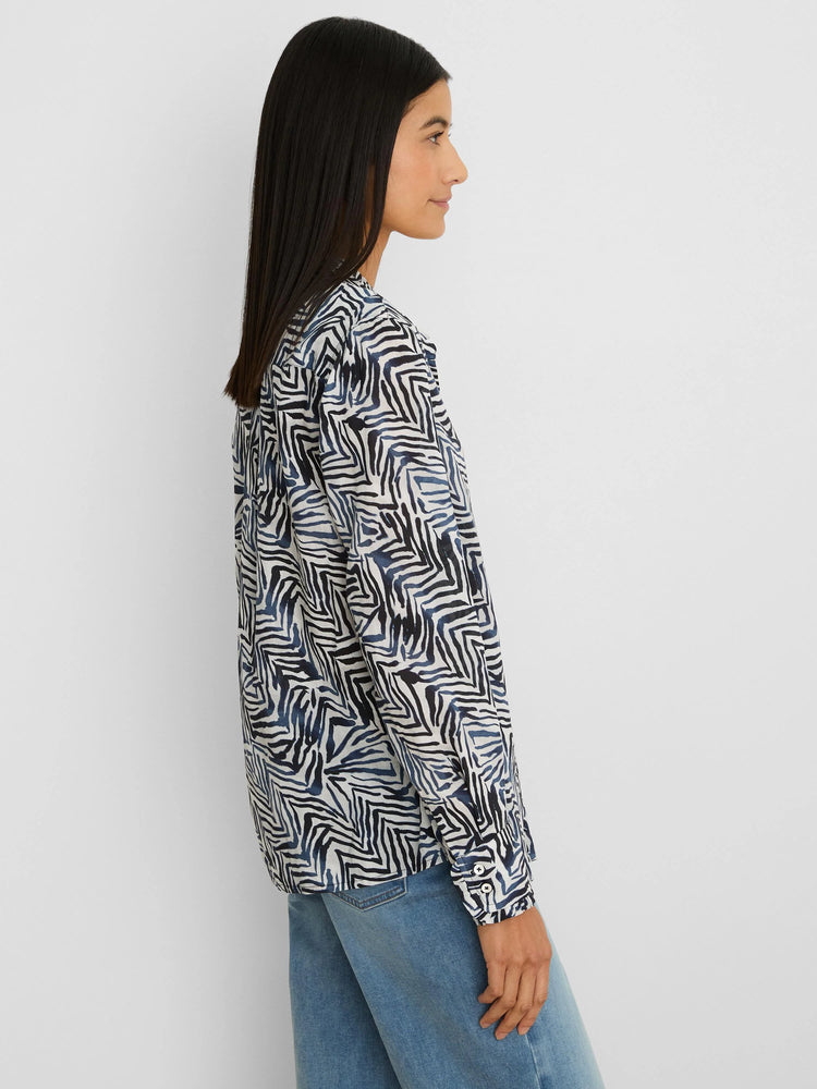 Off-white long-sleeve shirt with jagged black and dark blue line pattern.