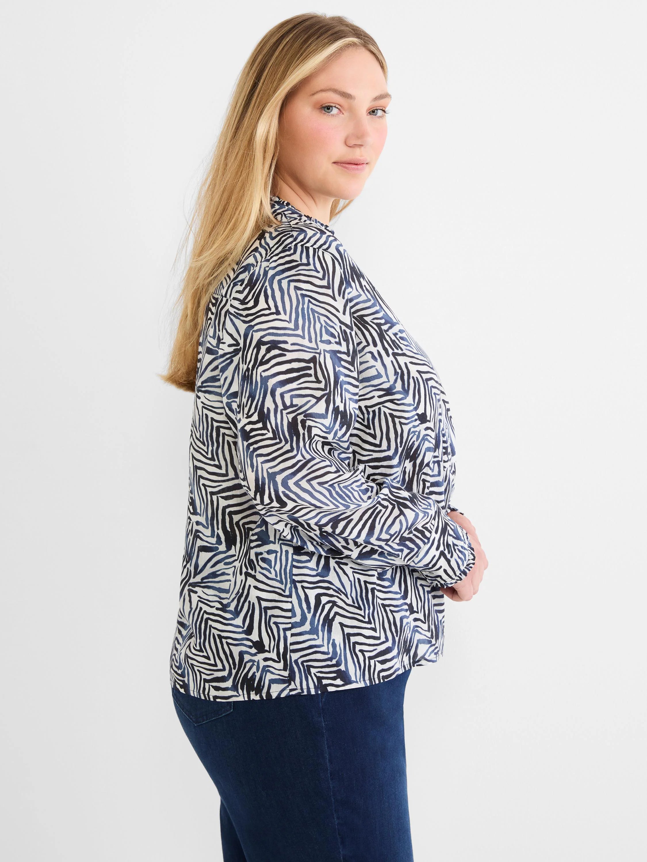 Cream long-sleeved shirt with an abstract pattern of inky dark blue and black geometric lines.