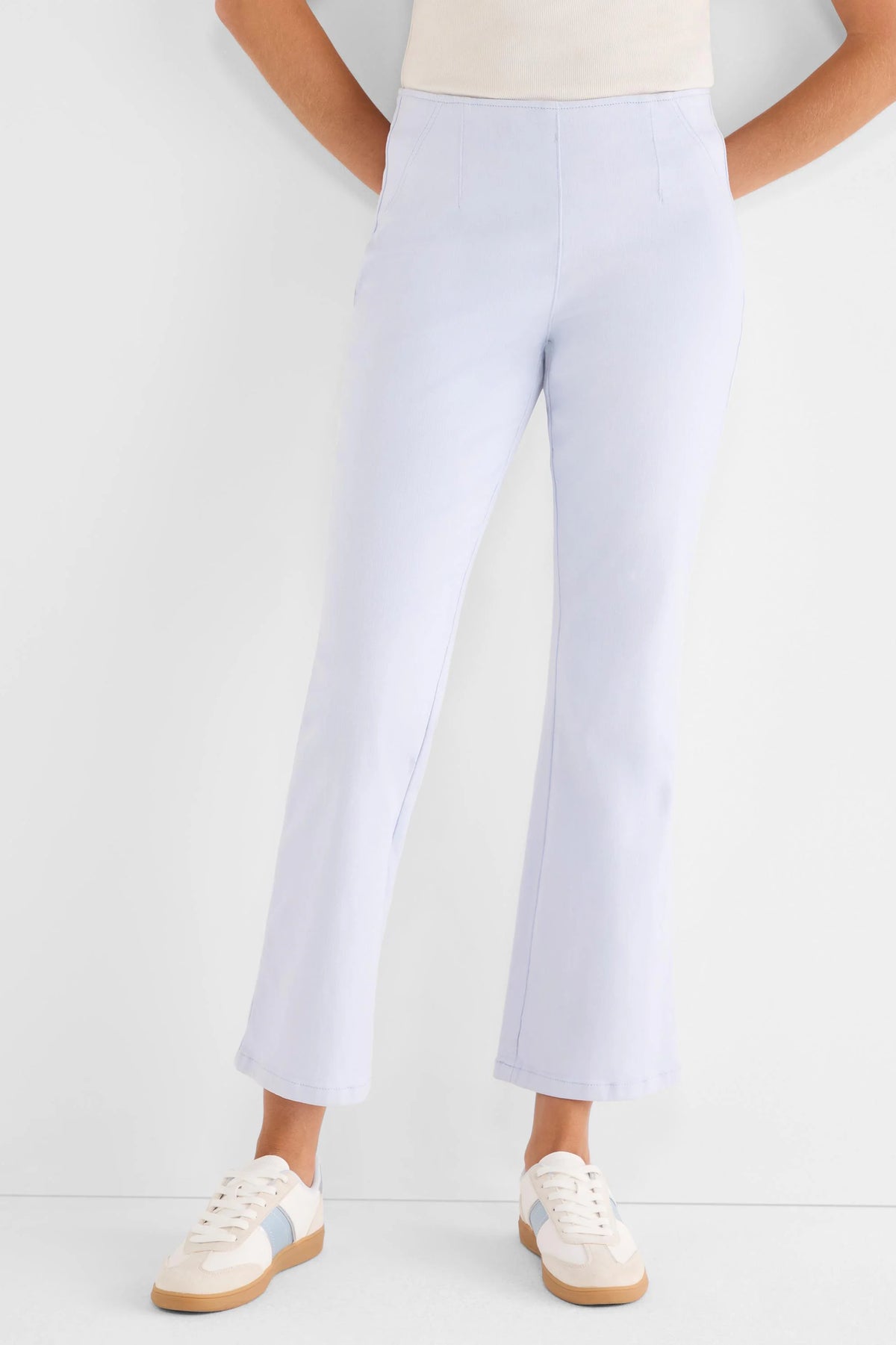 Pale blue high-waisted bootcut jeans with a smooth, flat front and cropped hem.