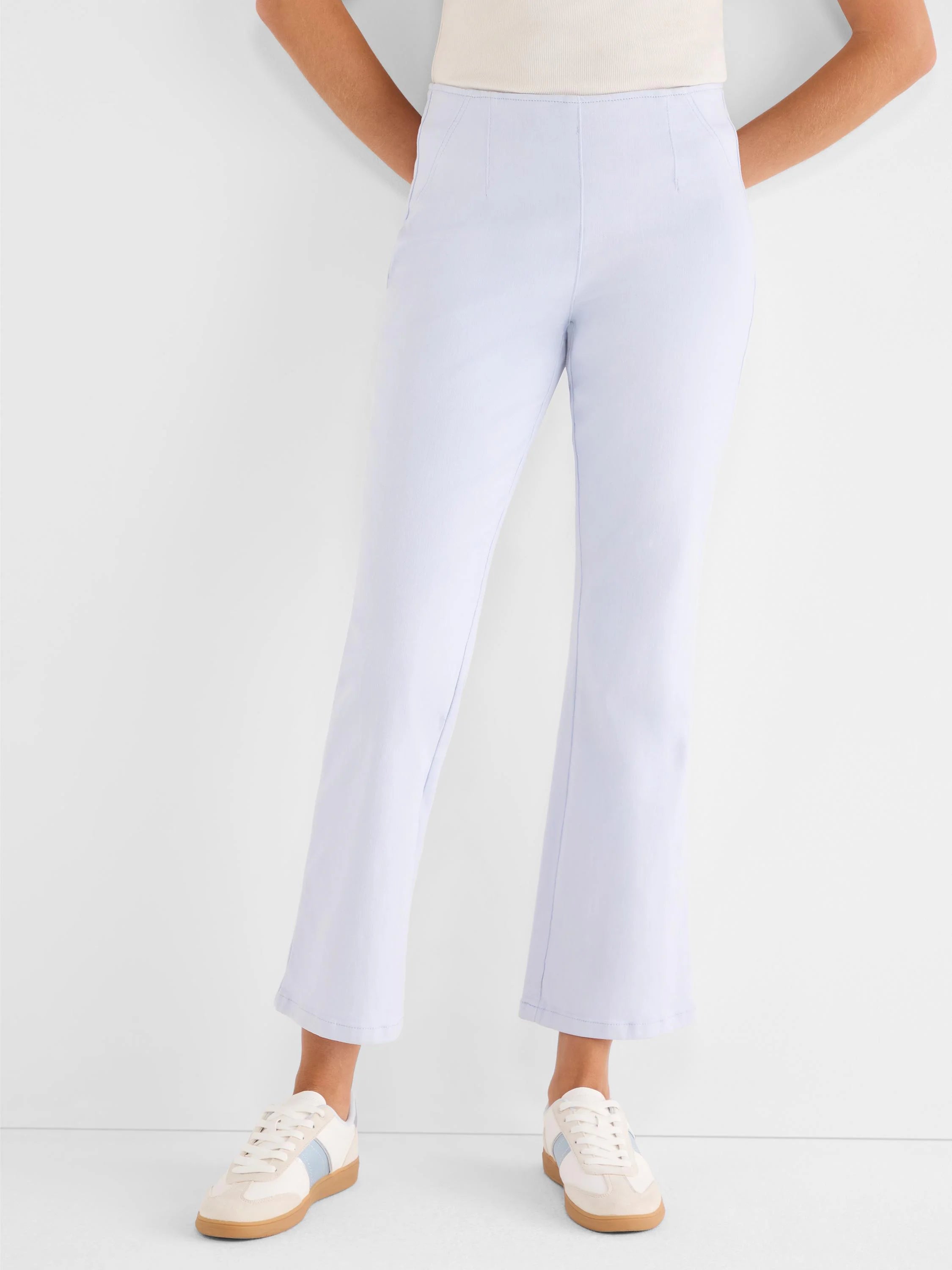 Pale blue high-waisted bootcut jeans with a smooth, flat front and cropped hem.