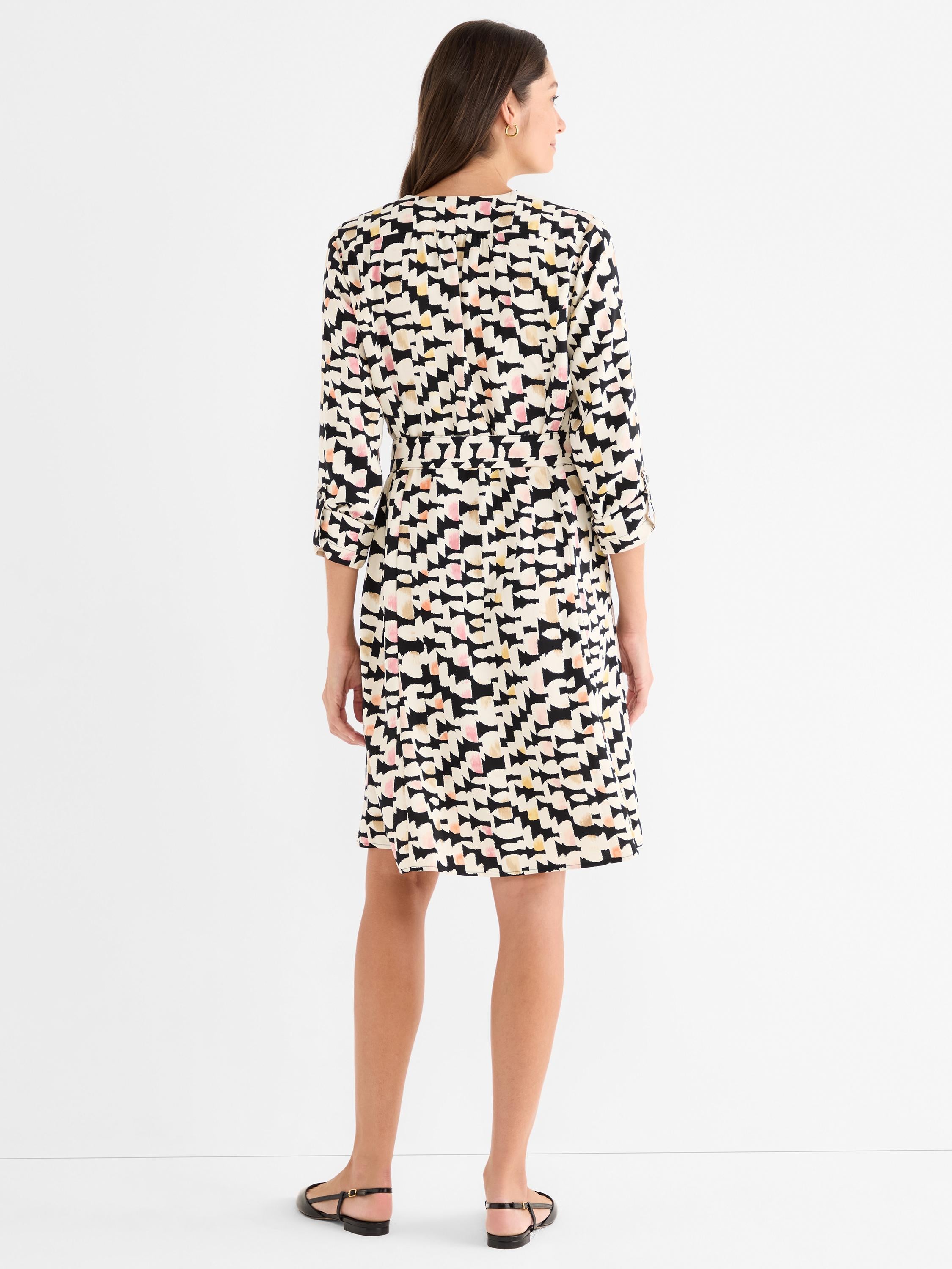 Relaxed fit multicolor abstract print dress with 3/4 sleeves and a self-tie waist, ending at the knee.