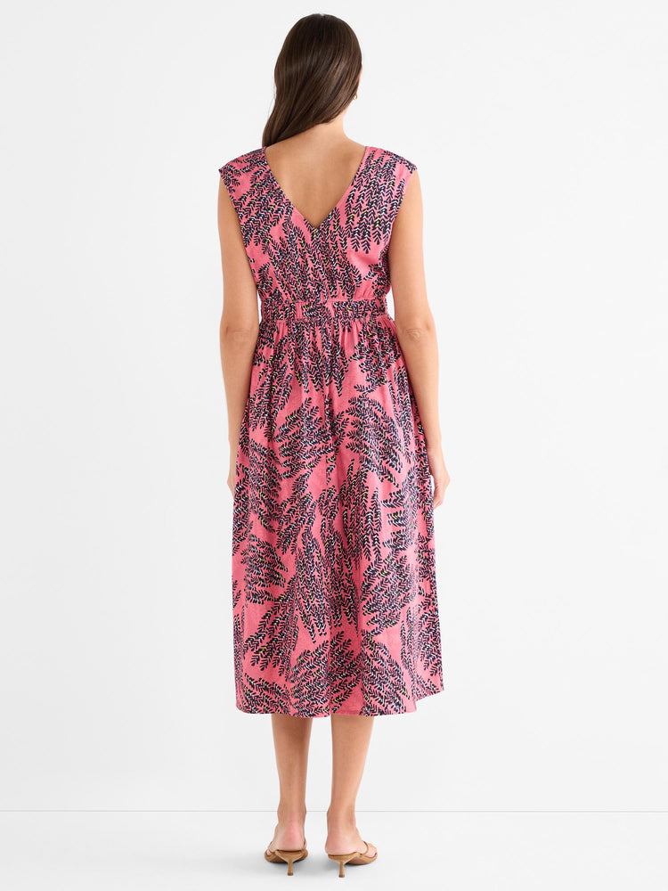 This pink patterned sleeveless midi dress features a V-back and a fitted smocked waist.