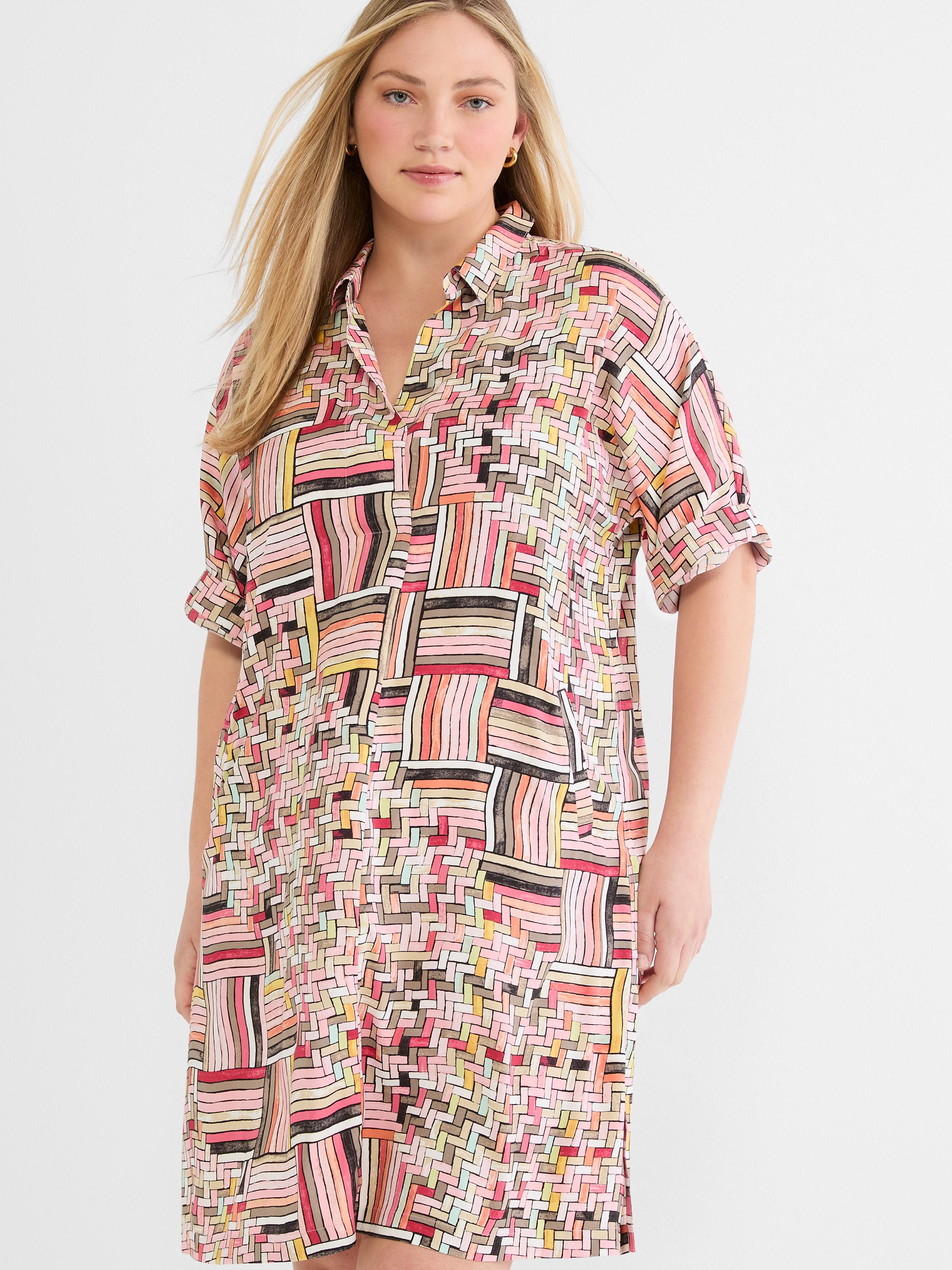 This relaxed fit, short-sleeve shirtdress features a vibrant multicolored abstract woven print and an open collar.