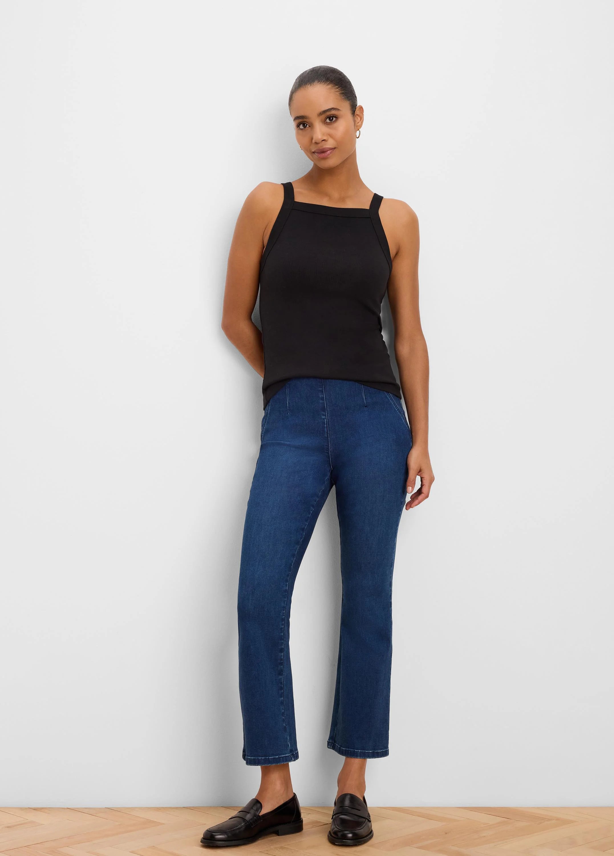 Black ribbed square neck tank top worn by a woman.