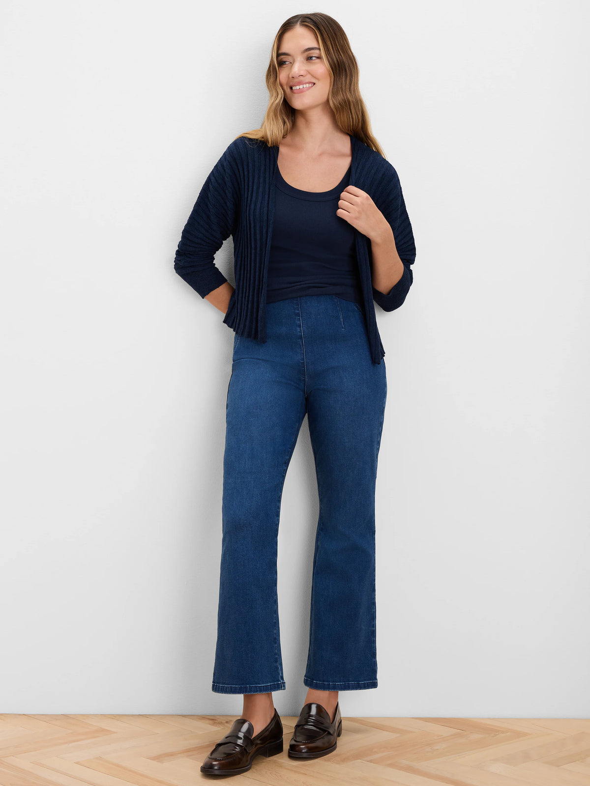 Navy blue open cardigan with accordion ribbing and 3/4 sleeves.