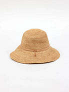 Beige crochet bucket hat with a light brown leather band.