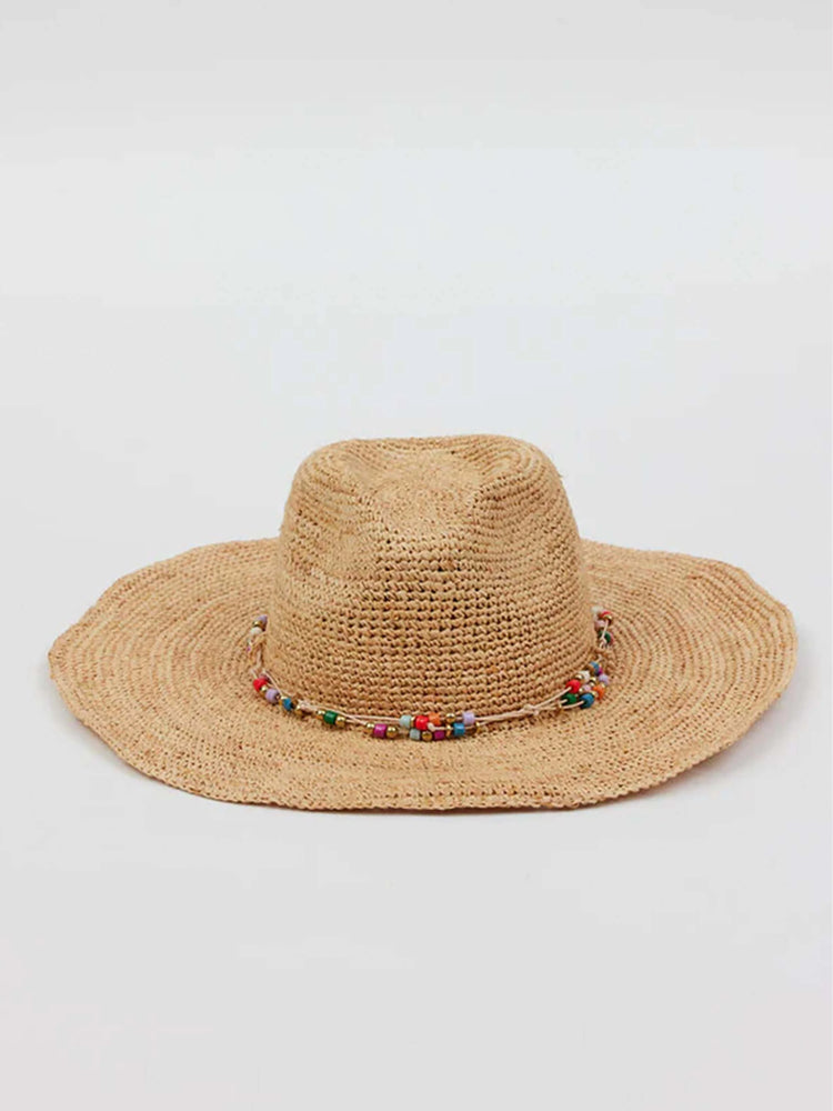 Tan woven straw hat with wide, floppy brim. Features a band of small, multi-colored round beads around the crown.