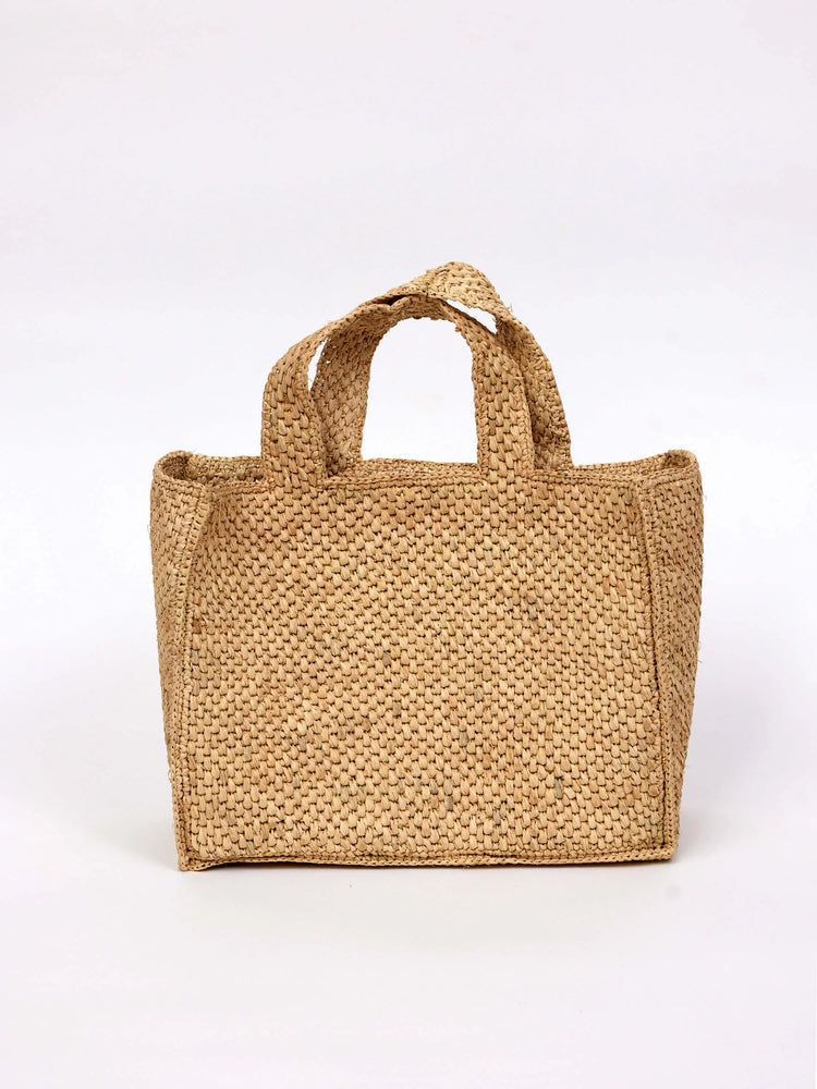 Light beige, woven straw tote bag with double top handles. Rectangular shape.