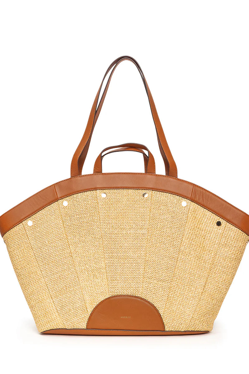 Hammitt Shelly Tote: Tan woven straw, fan-shaped body, brown leather trim, handles & half-circle base accent, silver studs.
