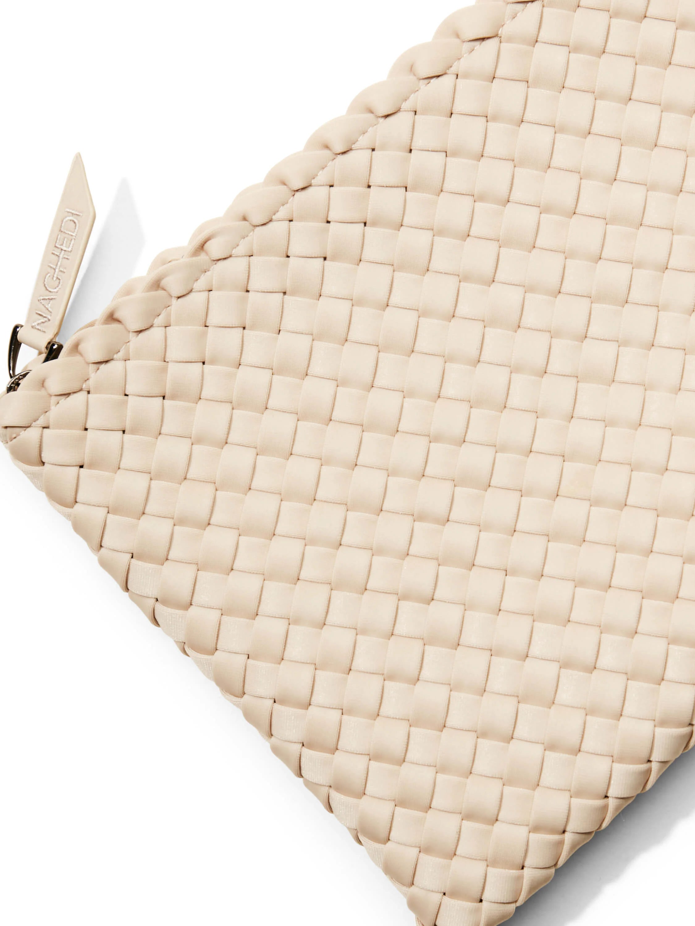 Beige woven tote bag with a small label. The weave is a tight, square pattern.