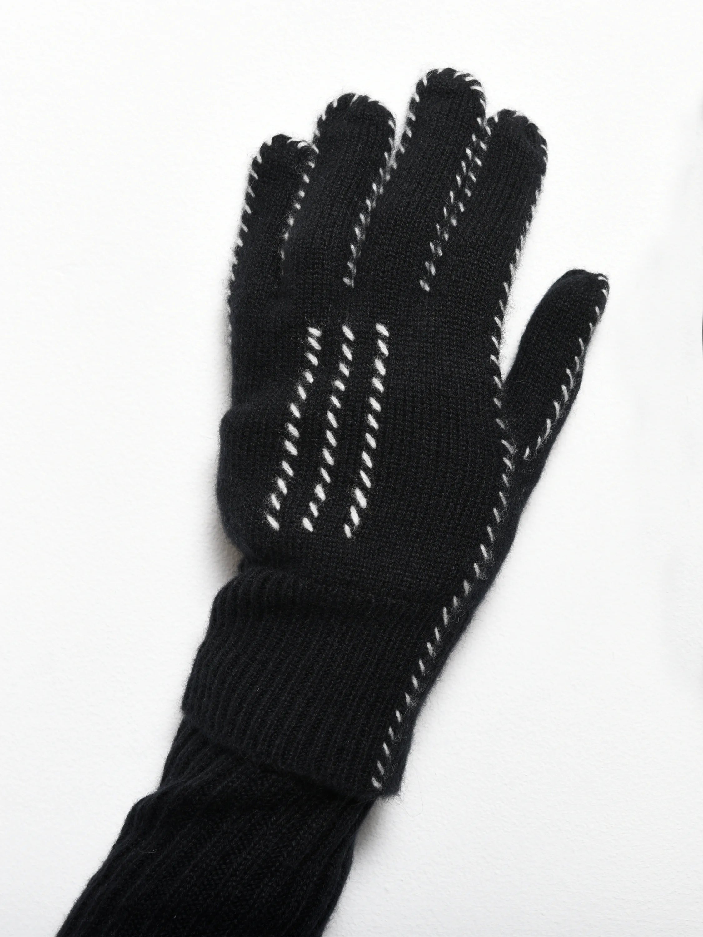 Black cashmere gloves with off-white stitching detail.