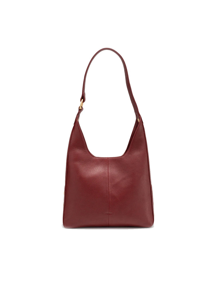 Burgundy leather medium hobo bag with a curved top, single shoulder strap, and gold-tone hardware.