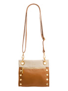 Small two-tone cream and tan leather crossbody bag with gold zipper, hardware, and side studs. Adjustable tan strap.