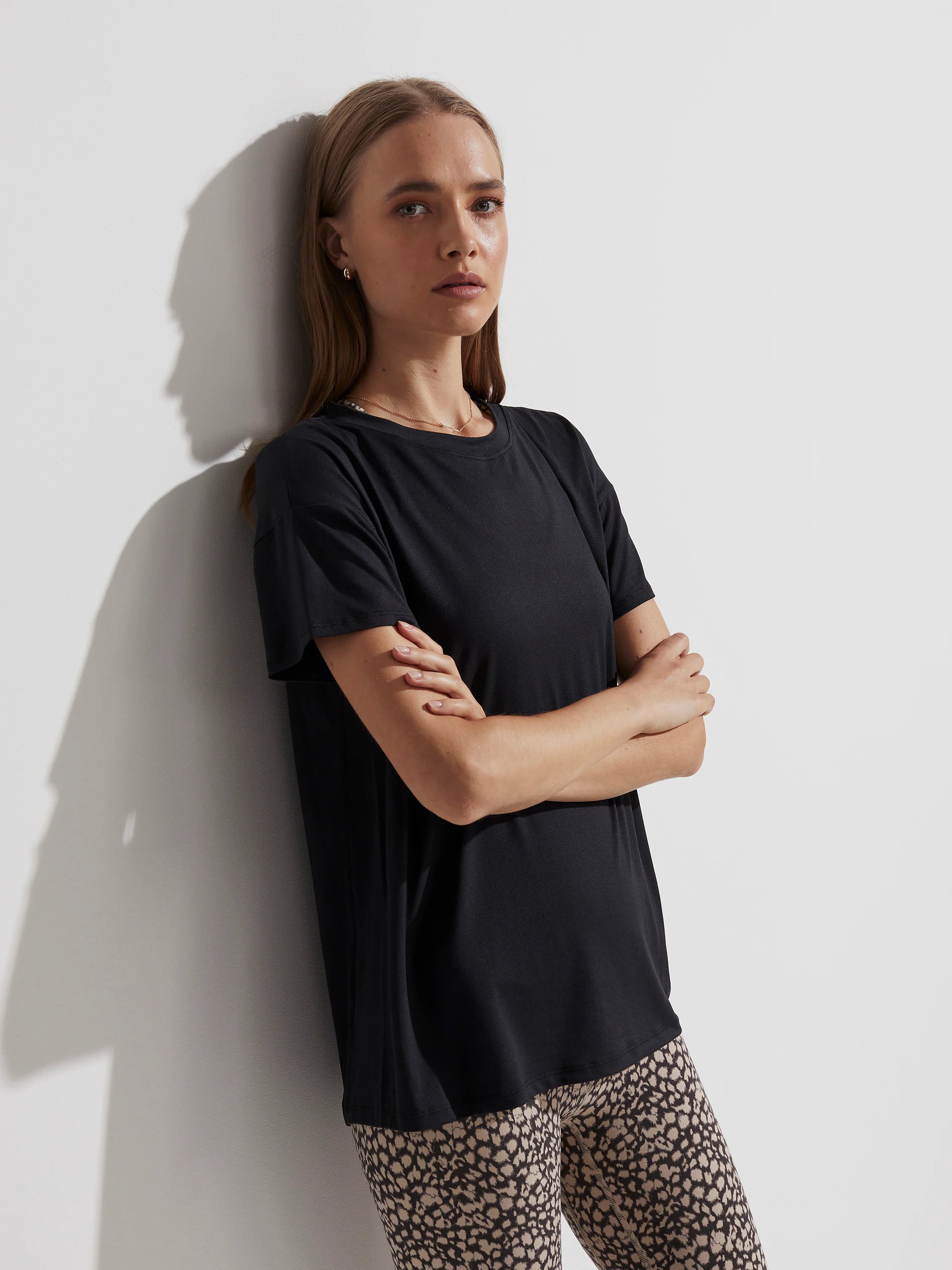 Black, short-sleeved, crew neck t-shirt with a relaxed fit.