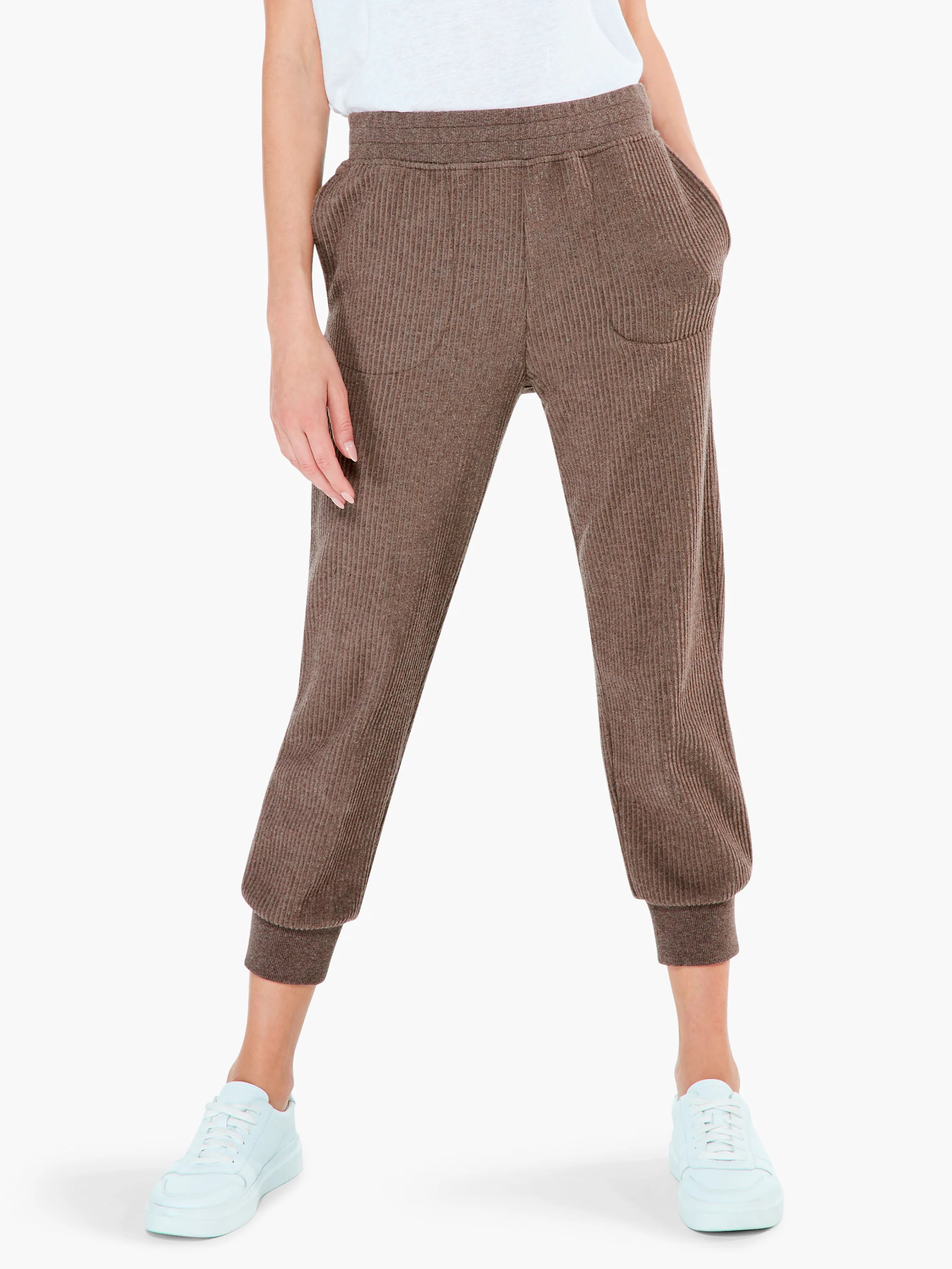 Brown ribbed knit sweatpants, cropped, with an elastic waist, pockets, and ribbed cuffs.