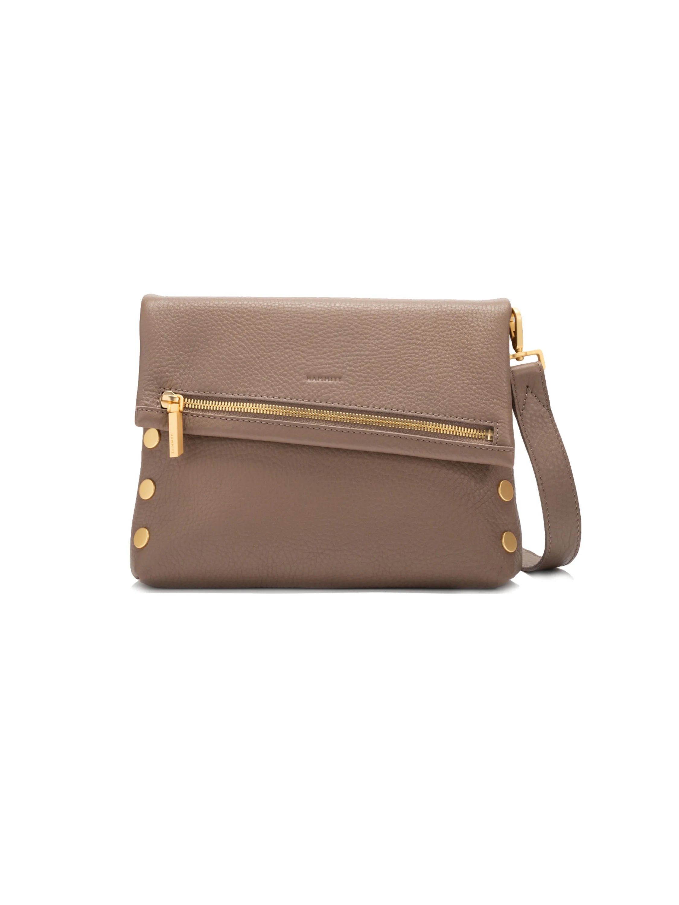 Taupe pebbled leather bag with gold hardware, including a diagonal front zipper, four studs, and an adjustable strap.