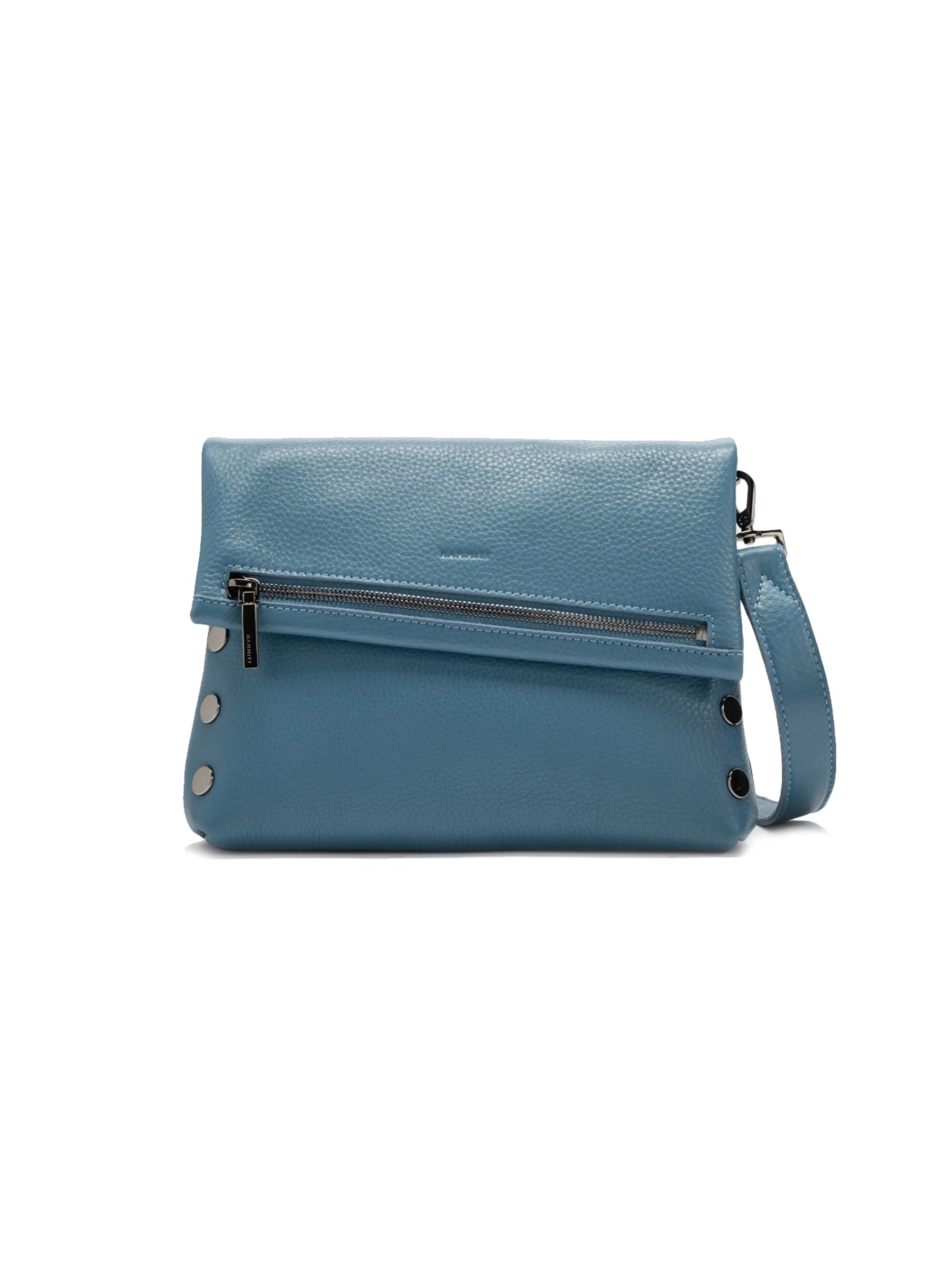 Medium dusty blue pebbled leather bag with a fold-over flap, silver front zipper, side rivets, and detachable strap.