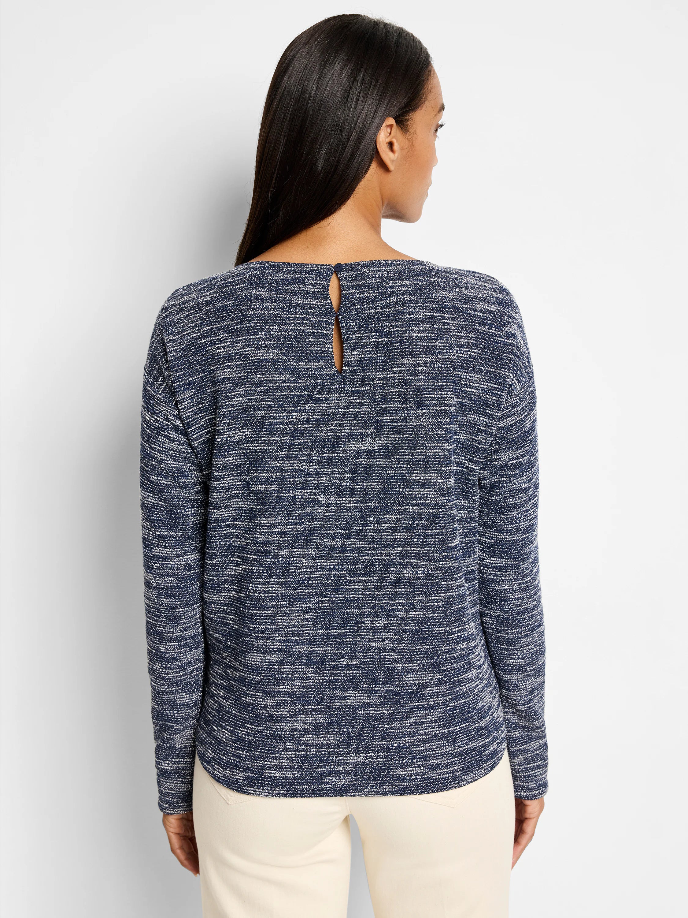 Indigo and white speckled long-sleeve knit top; keyhole back detail.