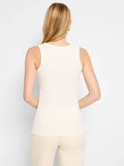 Ivory ribbed knit tank top, shown on a model from the back.