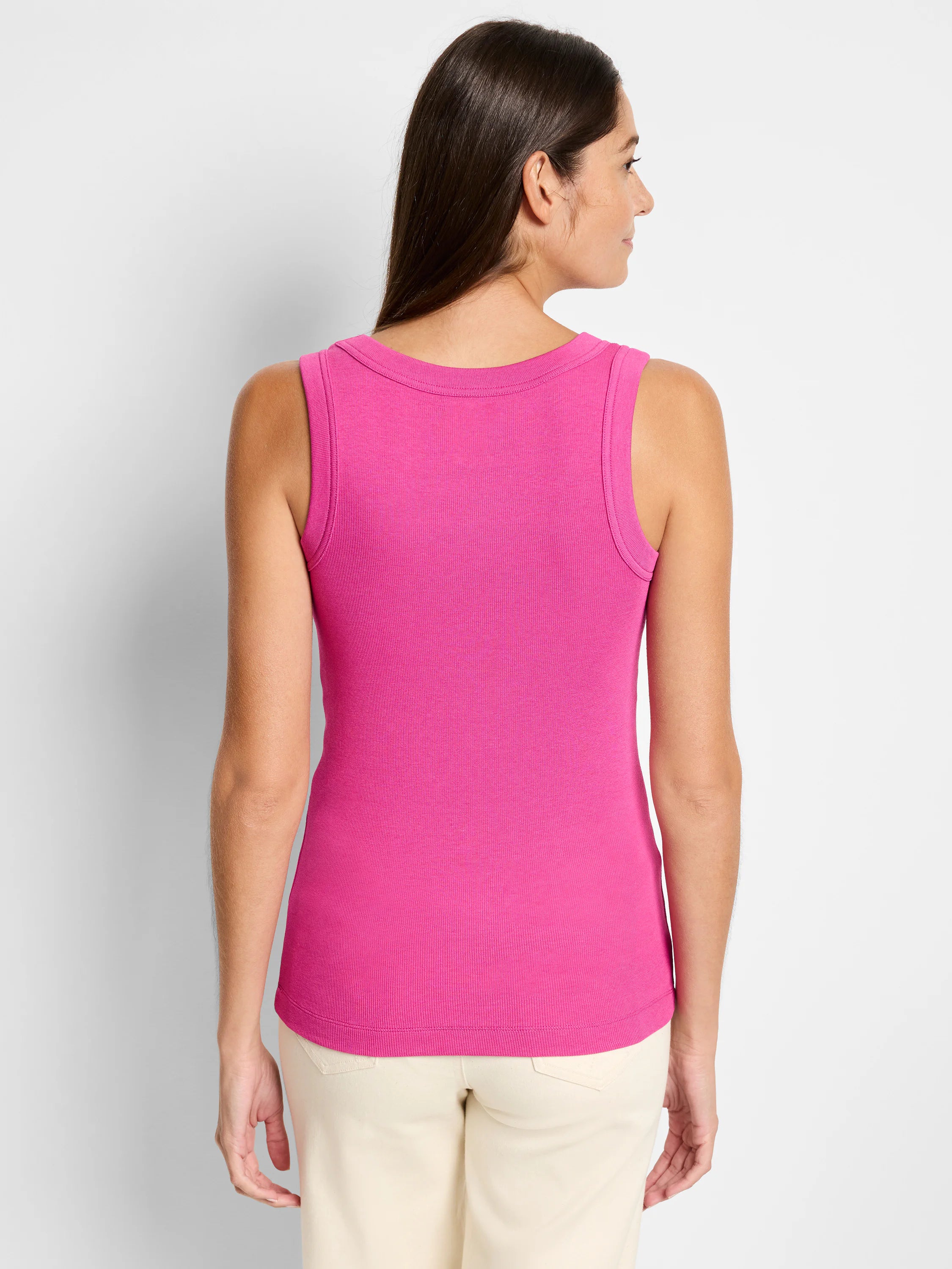 Magenta ribbed knit scoop tank, shown from behind on a model. Close-fitting design.