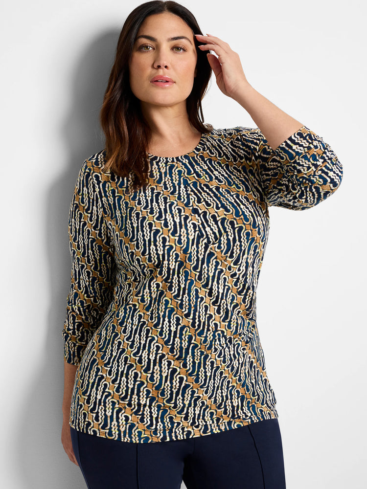 Brown, teal, and cream batik print 3/4 sleeve drape top. Abstract wavy pattern.