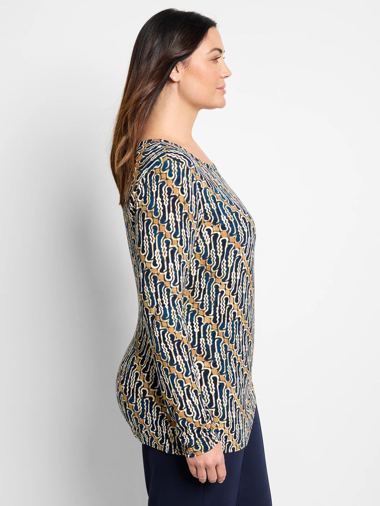 Long-sleeved top, blue, gold, and cream batik pattern. Round neckline.