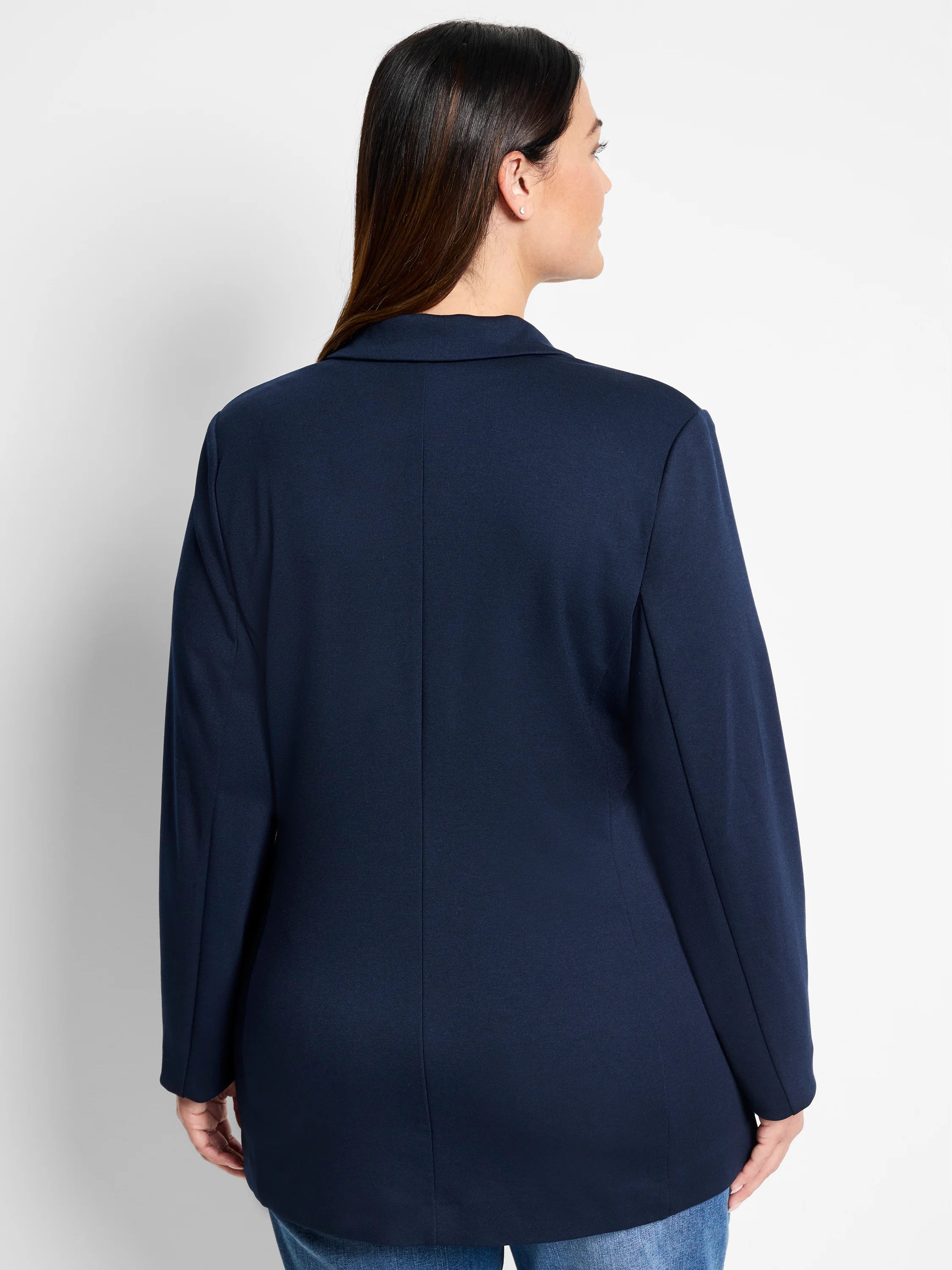 Navy blue zip-up jacket, long sleeves, collared. Rear view.