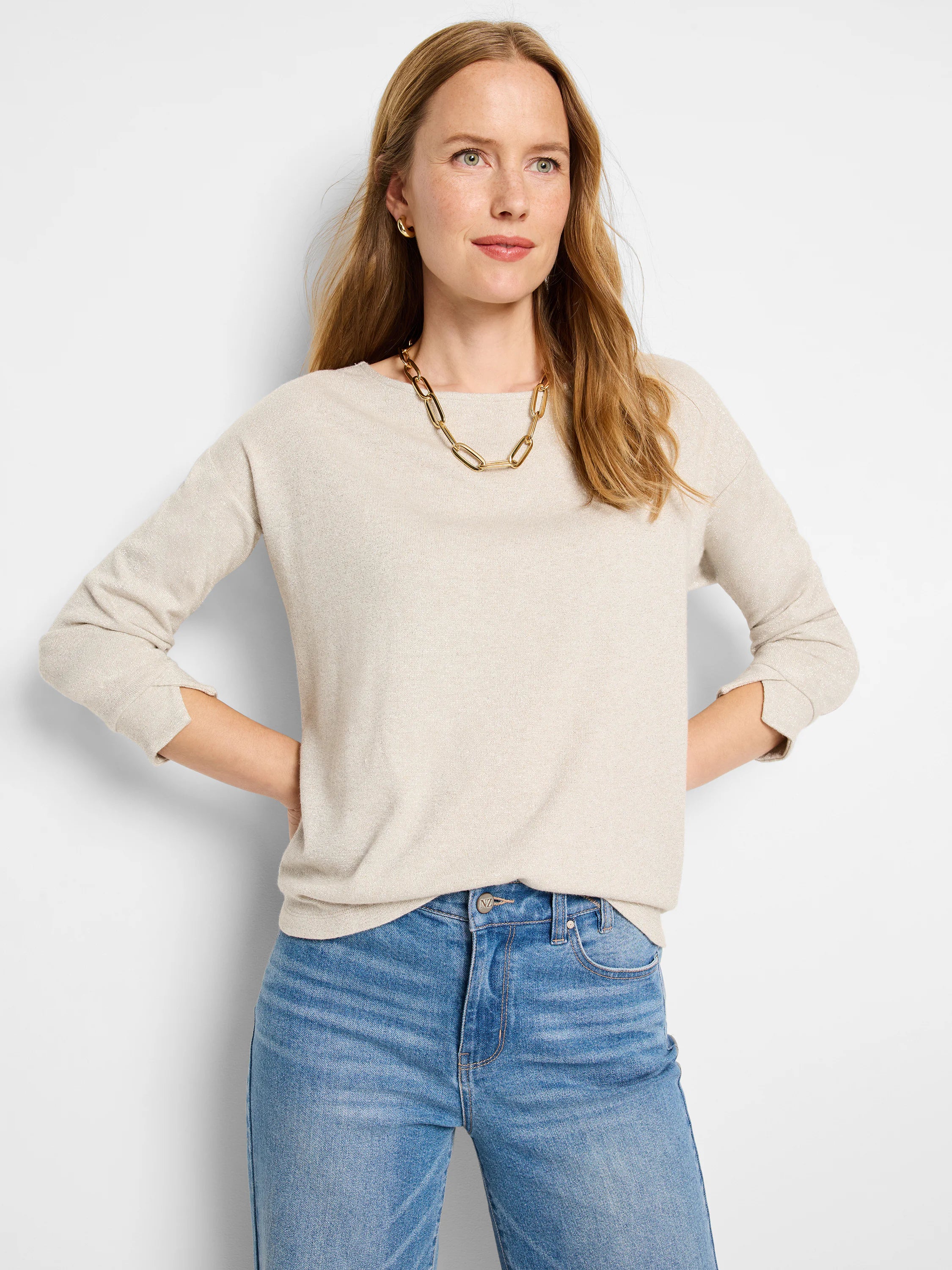 Beige sparkly knit top with three-quarter sleeves and boat neck.