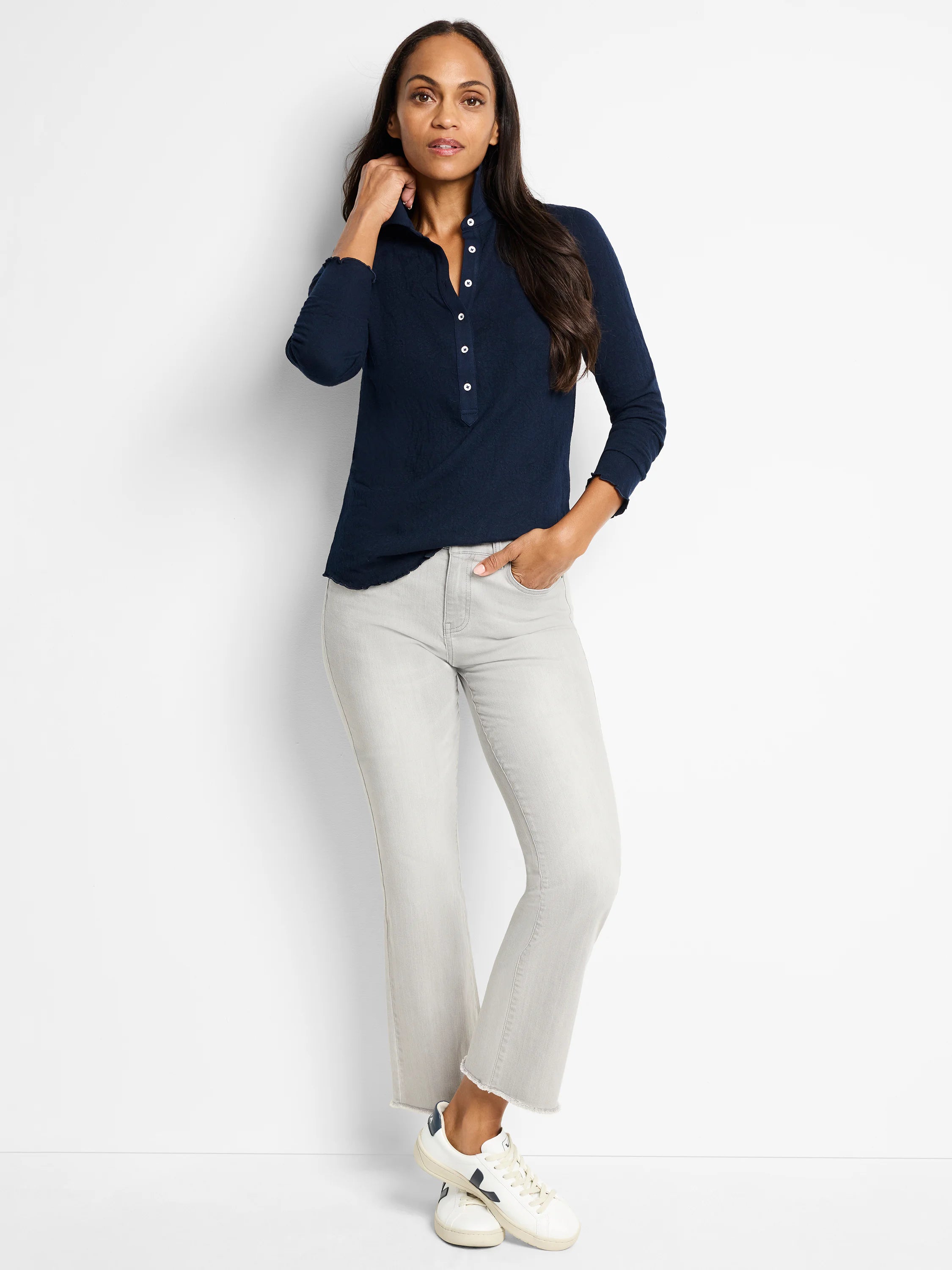 Navy blue lace knit collared top with white buttons, henley placket, and wavy lettuce hem details.