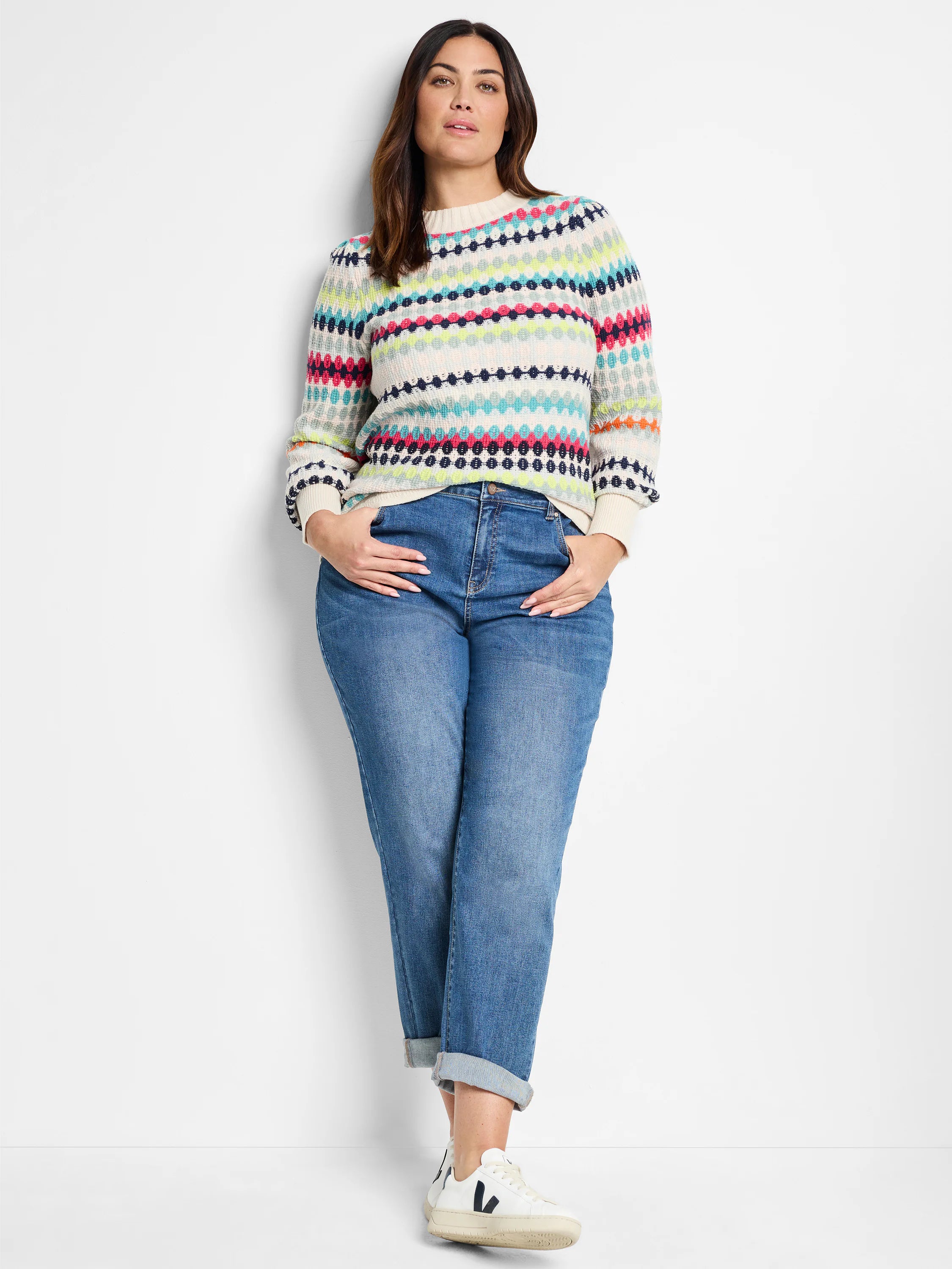 Cream waffle-knit sweater with horizontal stripes in teal, pink, lime, navy. Features a round neckline and long sleeves.
