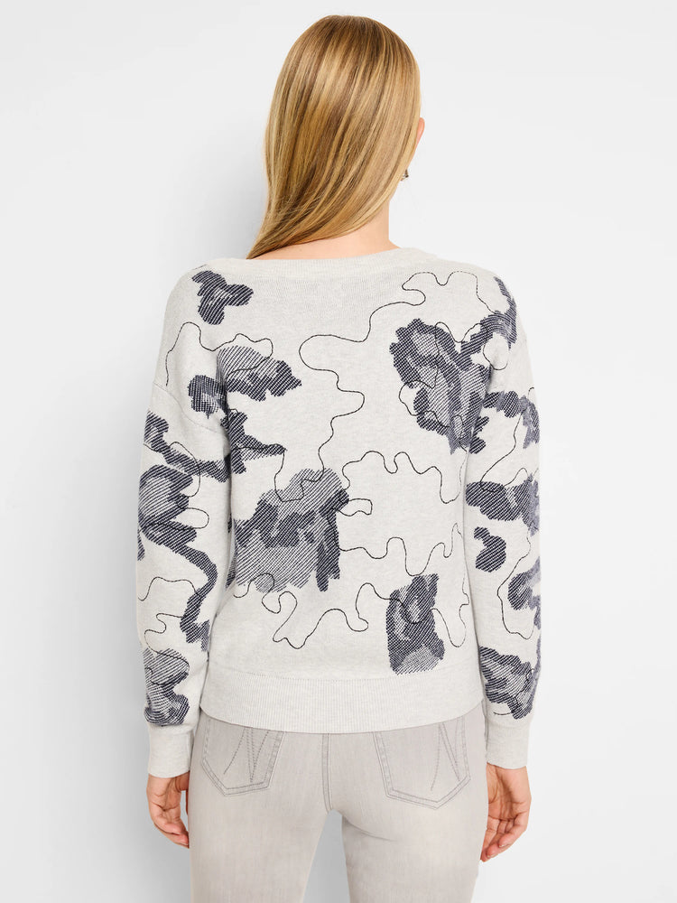 Light gray sweater with a dark gray abstract pattern. The pattern resembles camouflage.