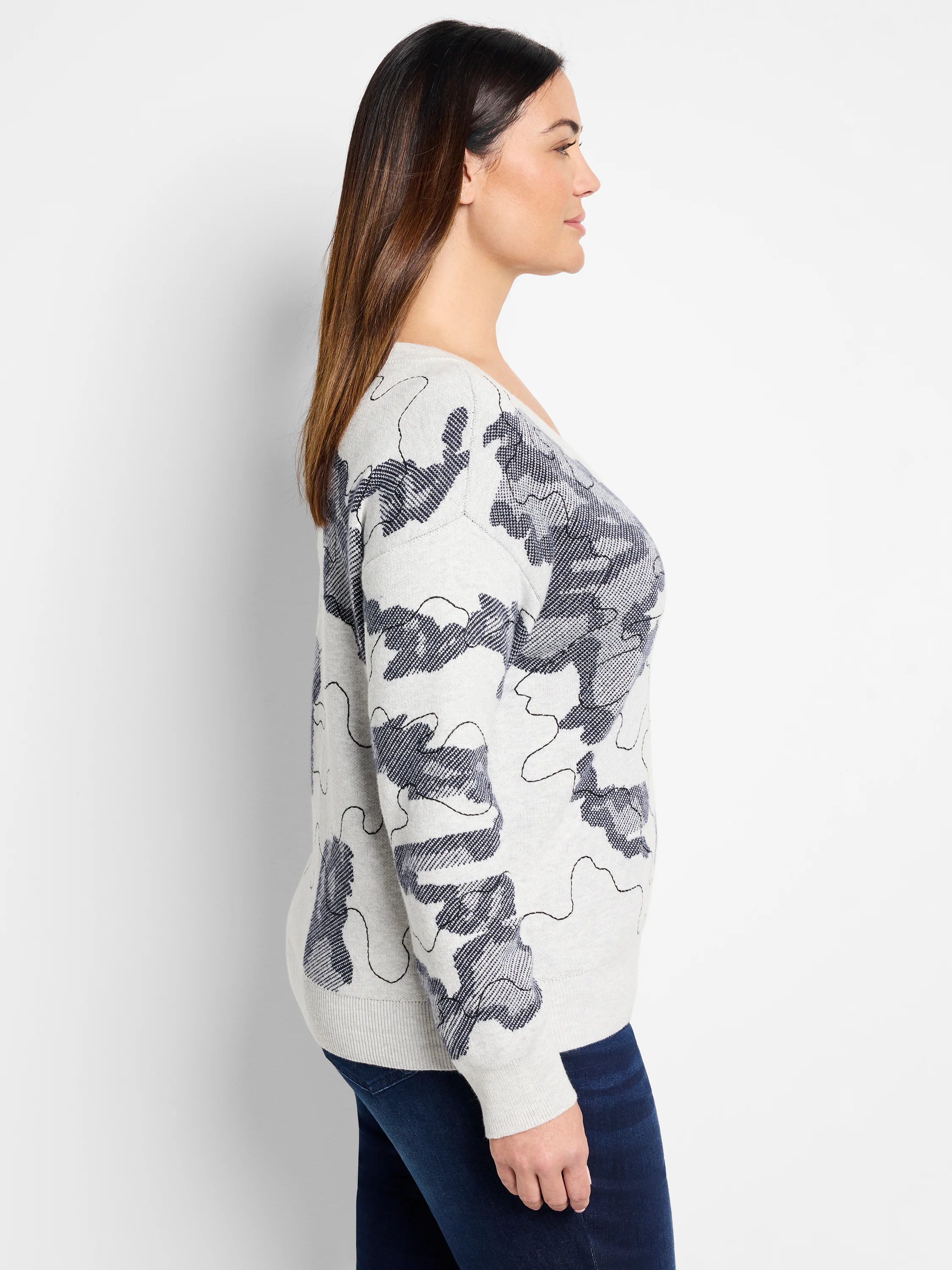 Light gray sweater with a dark gray abstract pattern. Long sleeves, relaxed fit.