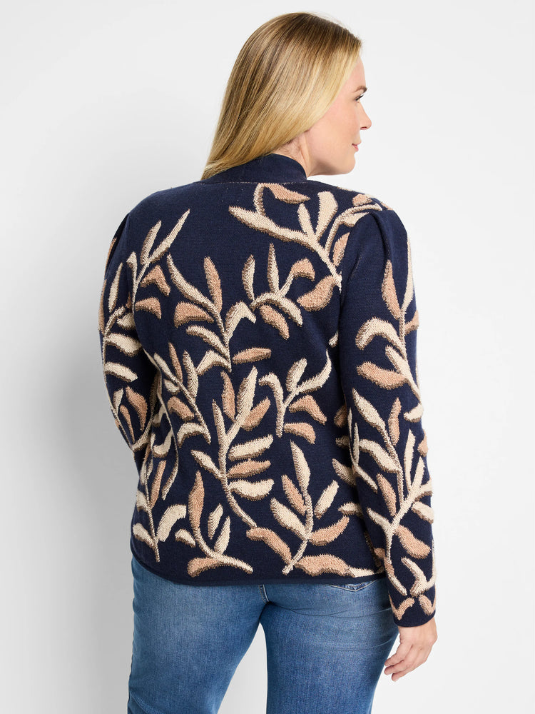 Dark blue knit jacket with a beige and brown leaf pattern. Mock neck.