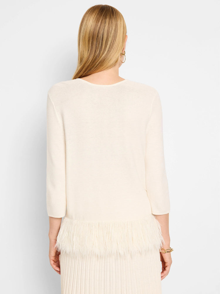Off-white sweater, 3/4 sleeves. Bottom features a white feather fringe.