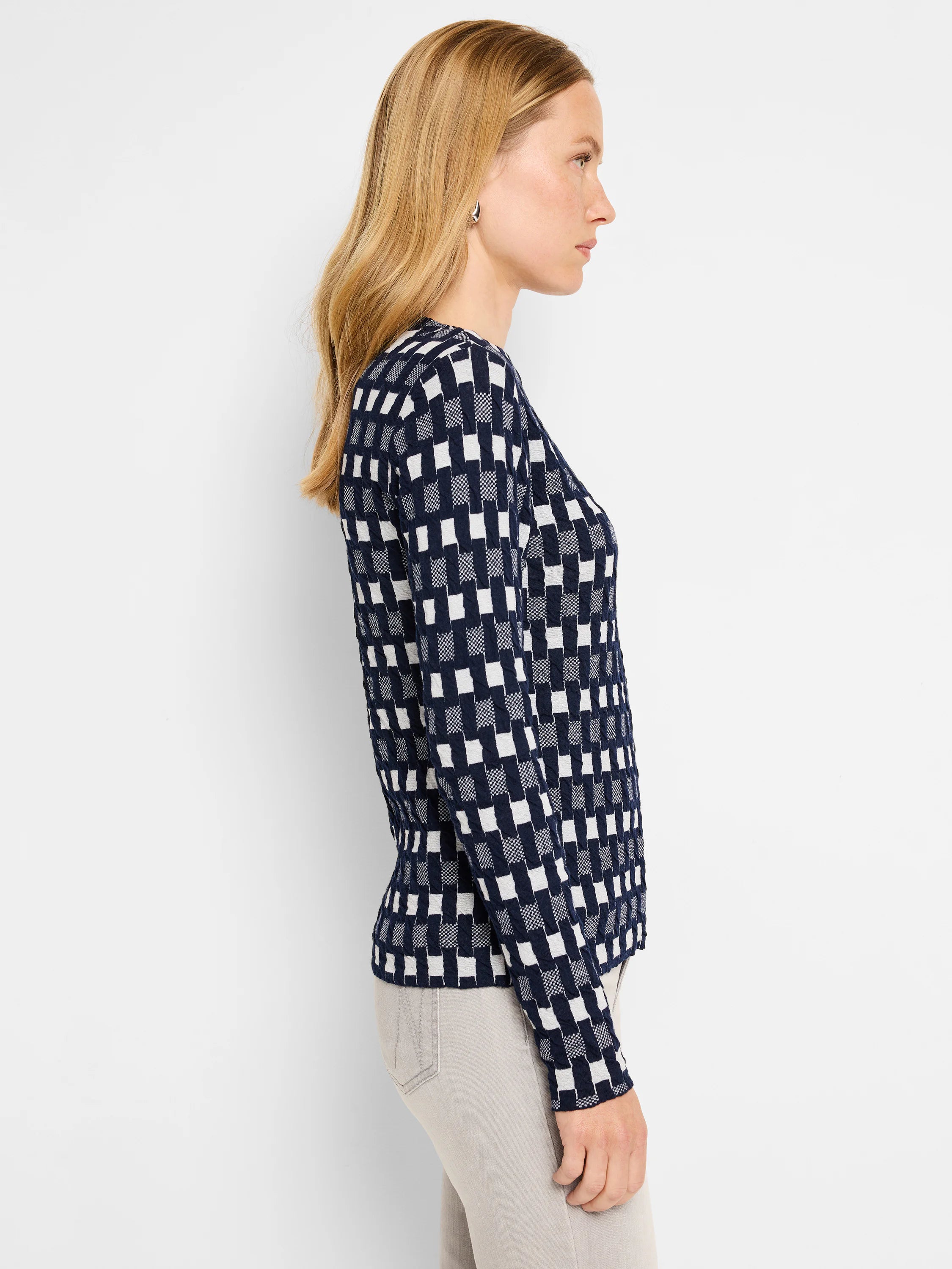 Navy blue and off-white checkered long-sleeve knit sweater tee. Textured fabric.