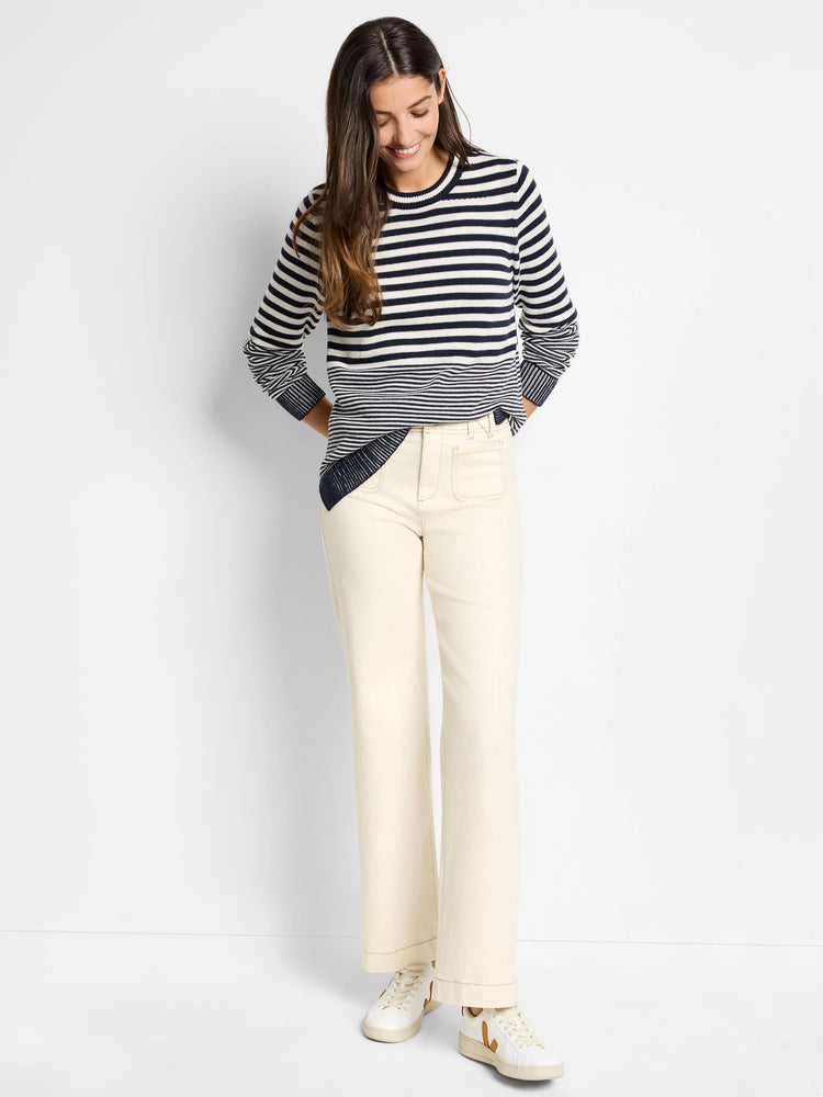 Cream and navy blue horizontally striped sweater. Long sleeves, crew neck.