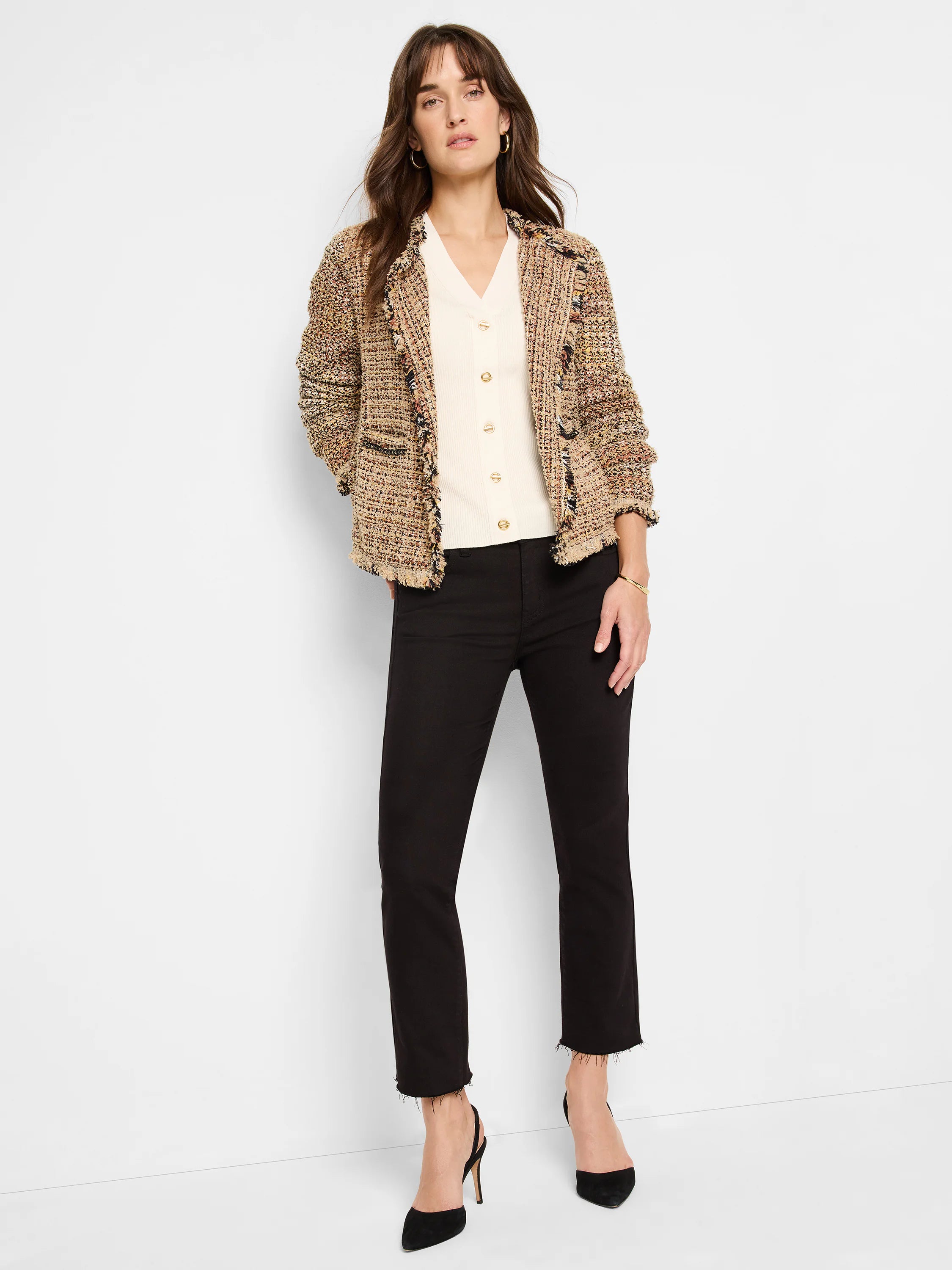 Beige tweed jacket with multicolor flecks, frayed edges. Model wears it over a cream top.