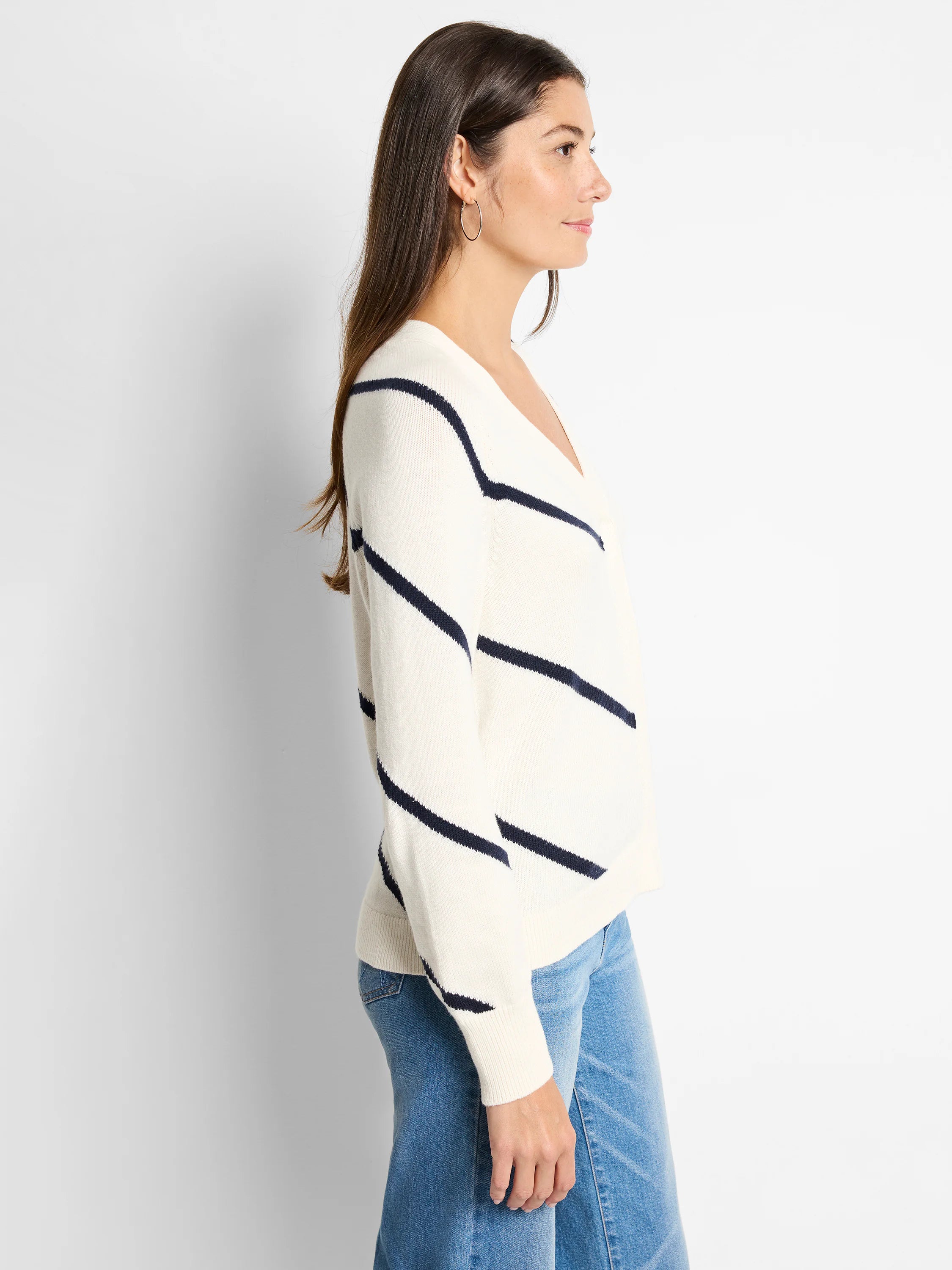 Off-white cardigan with diagonal navy stripes, V-neck.