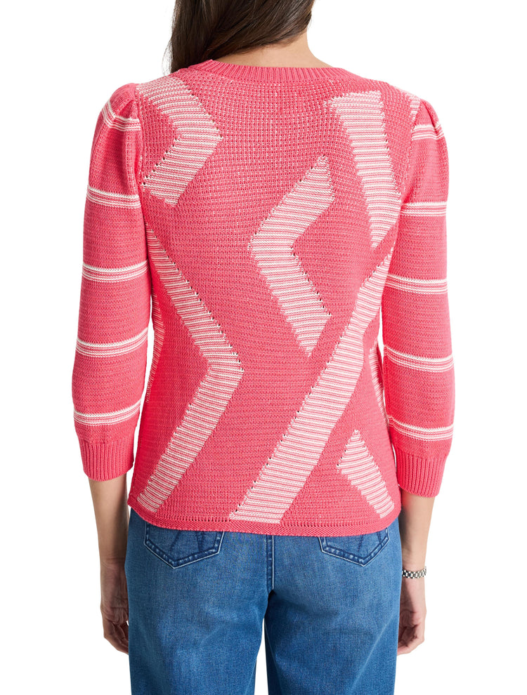 Pink sweater with white diagonal stripes and textured pattern. Three-quarter sleeves.