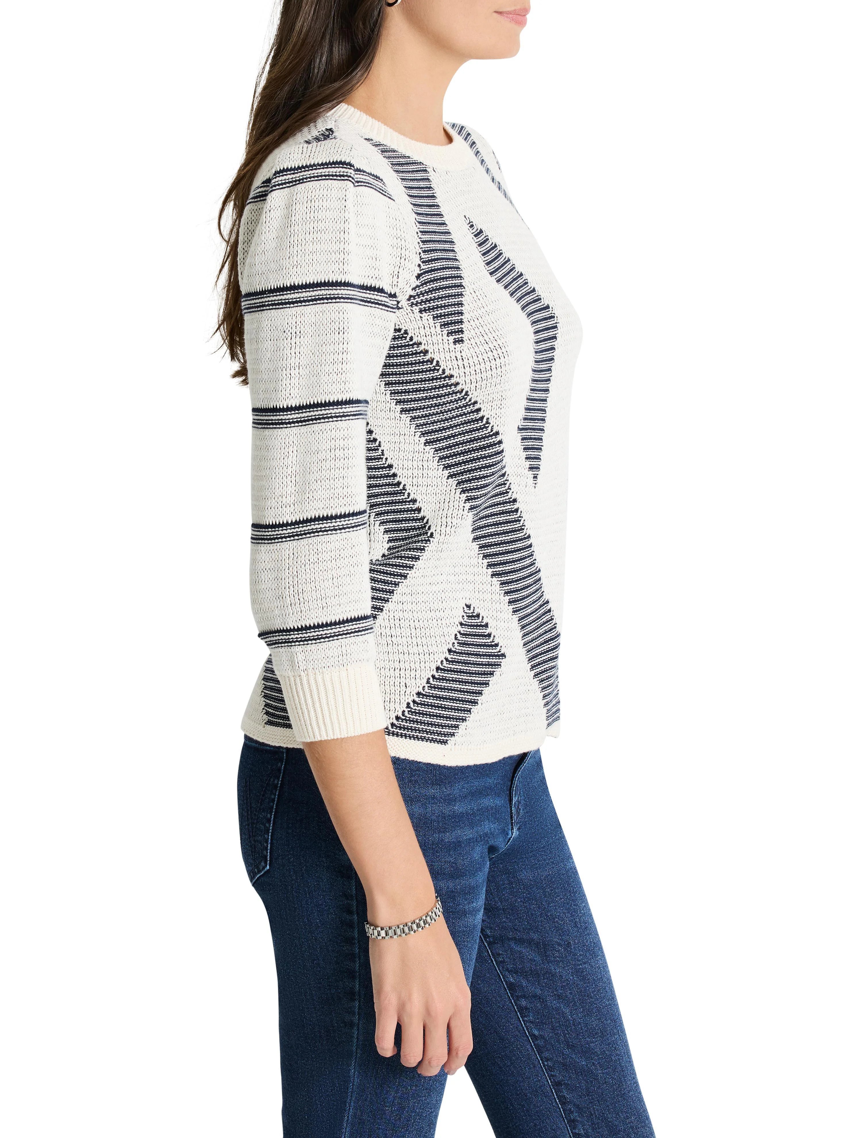 Cream-colored sweater with navy blue, geometric pattern; three-quarter sleeves; crew neck.