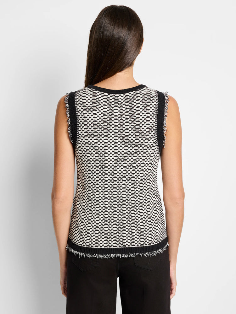 Black and off-white knit sleeveless tank top. Geometric pattern. Frayed edges.