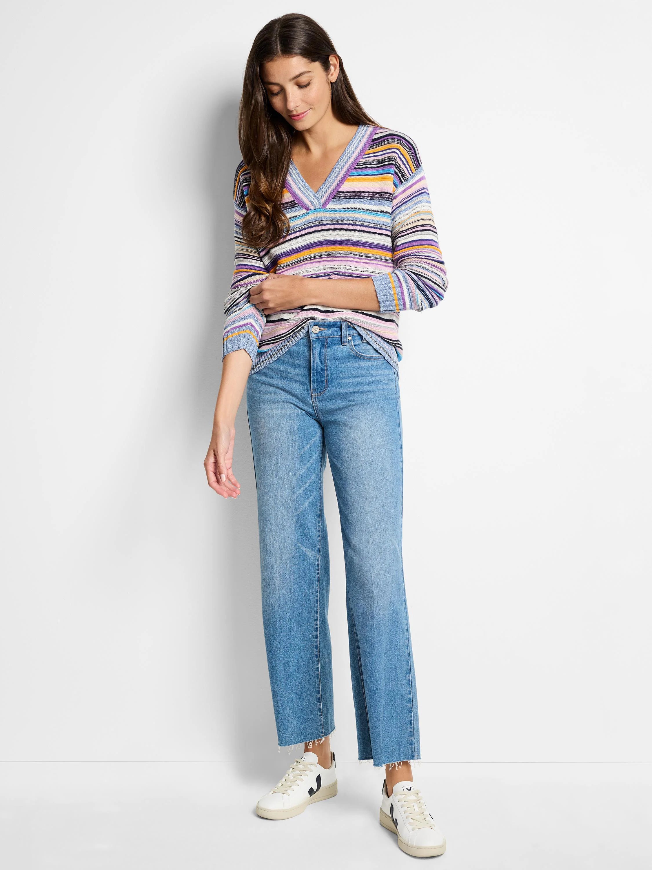 Multicolored striped V-neck sweater. Stripes in purple, blue, orange, and white. Long sleeves.