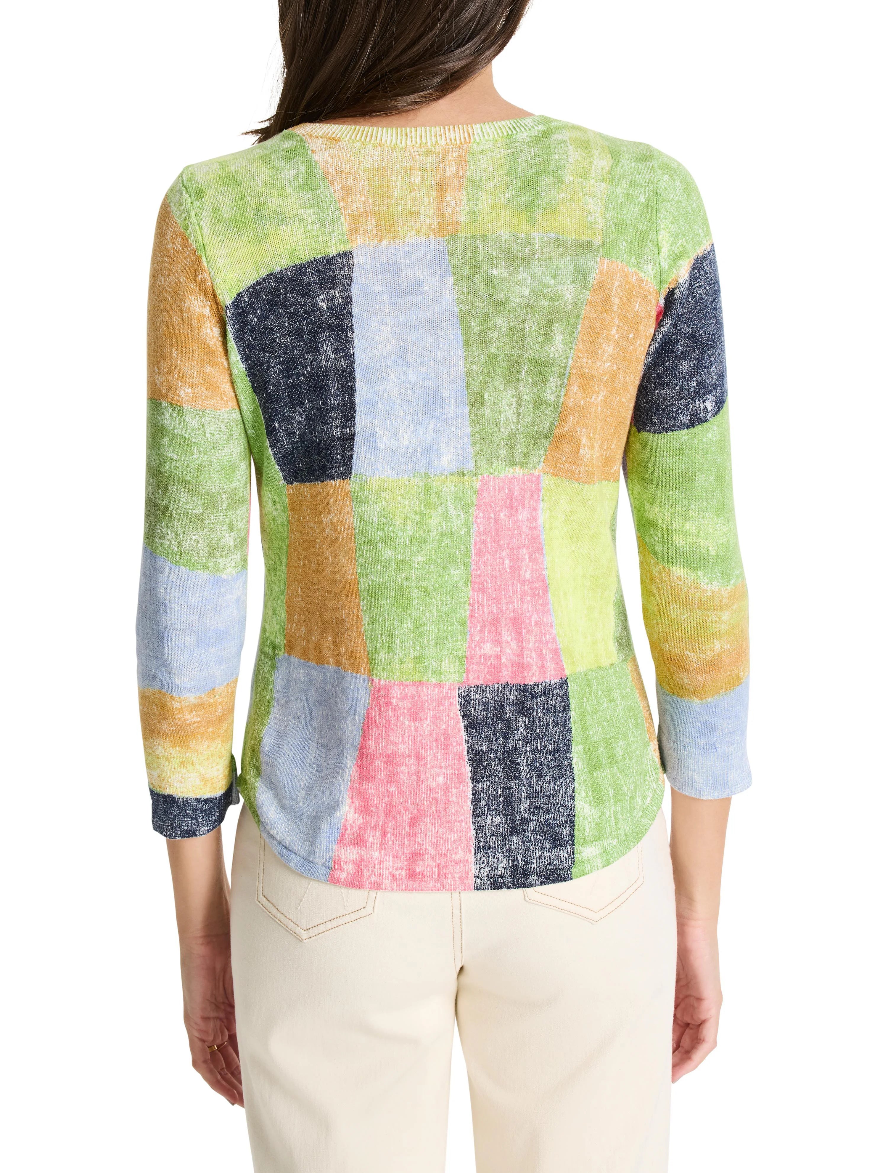 Multicolored knit sweater. Patchwork design in light blue, green, pink, and tan. Three-quarter sleeves.