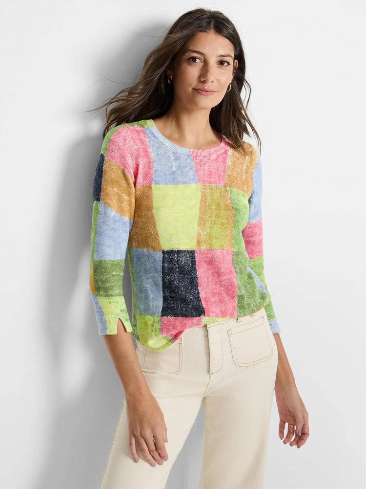 Pastel patchwork sweater. Light blue, pink, green, and tan color blocks. Three-quarter sleeves.