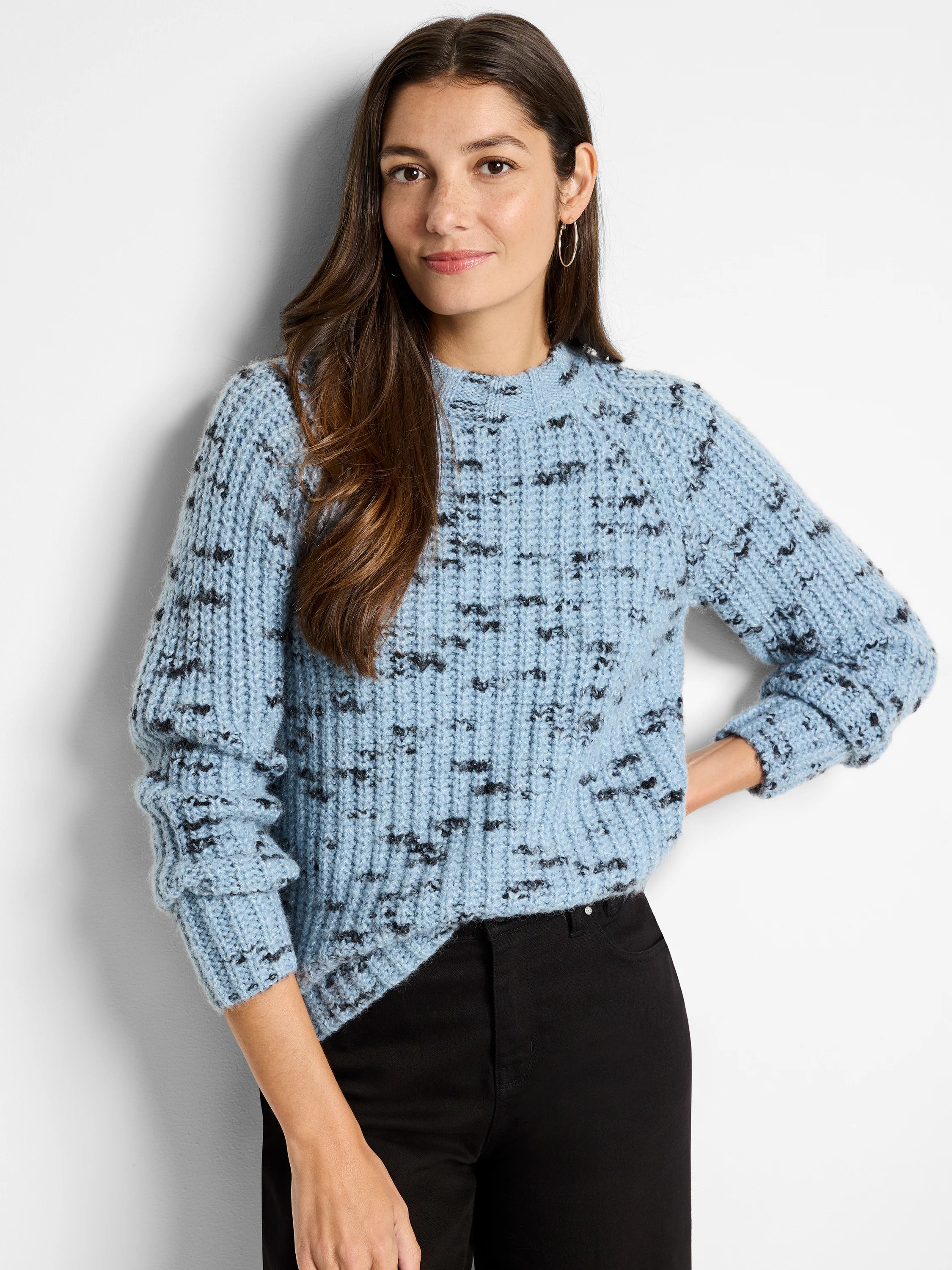 Light blue sweater with dark gray speckled pattern, long sleeves, and a mock neck.