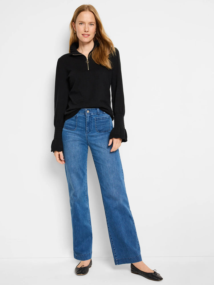 Black half-zip sweater with slightly puffed sleeves.