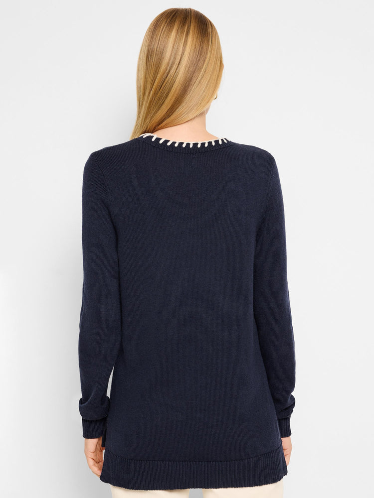 Navy blue sweater with off-white neckline detailing. Long sleeves, ribbed cuffs and hem.