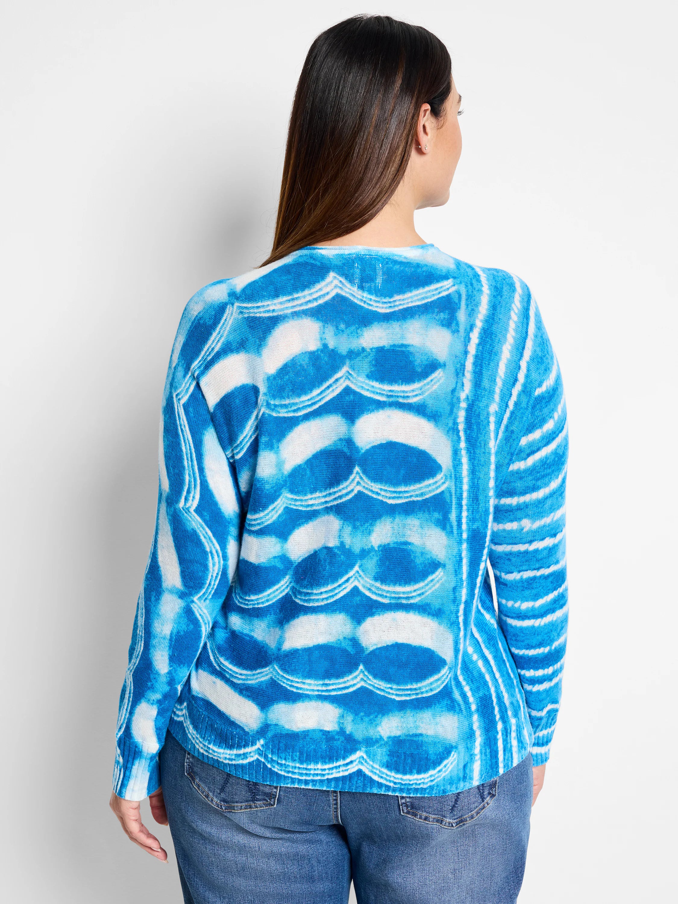 Blue and white tie-dye pattern sweater. Wave-like design. Long sleeves.
