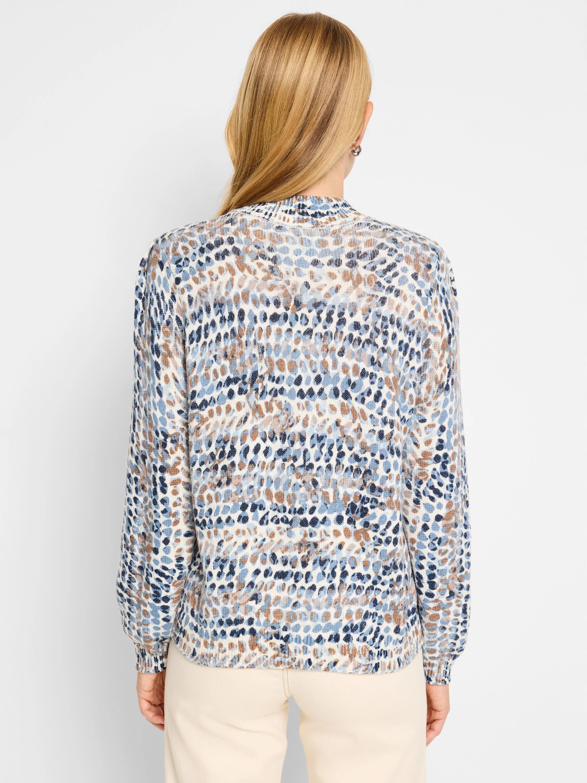 Cream henley sweater with blue and brown abstract spots. Long sleeves, ribbed cuffs and hem.