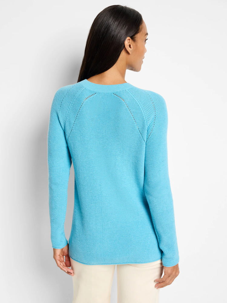 Light blue, V-neck cashmere sweater. Long sleeves, ribbed knit, subtle shoulder detailing.